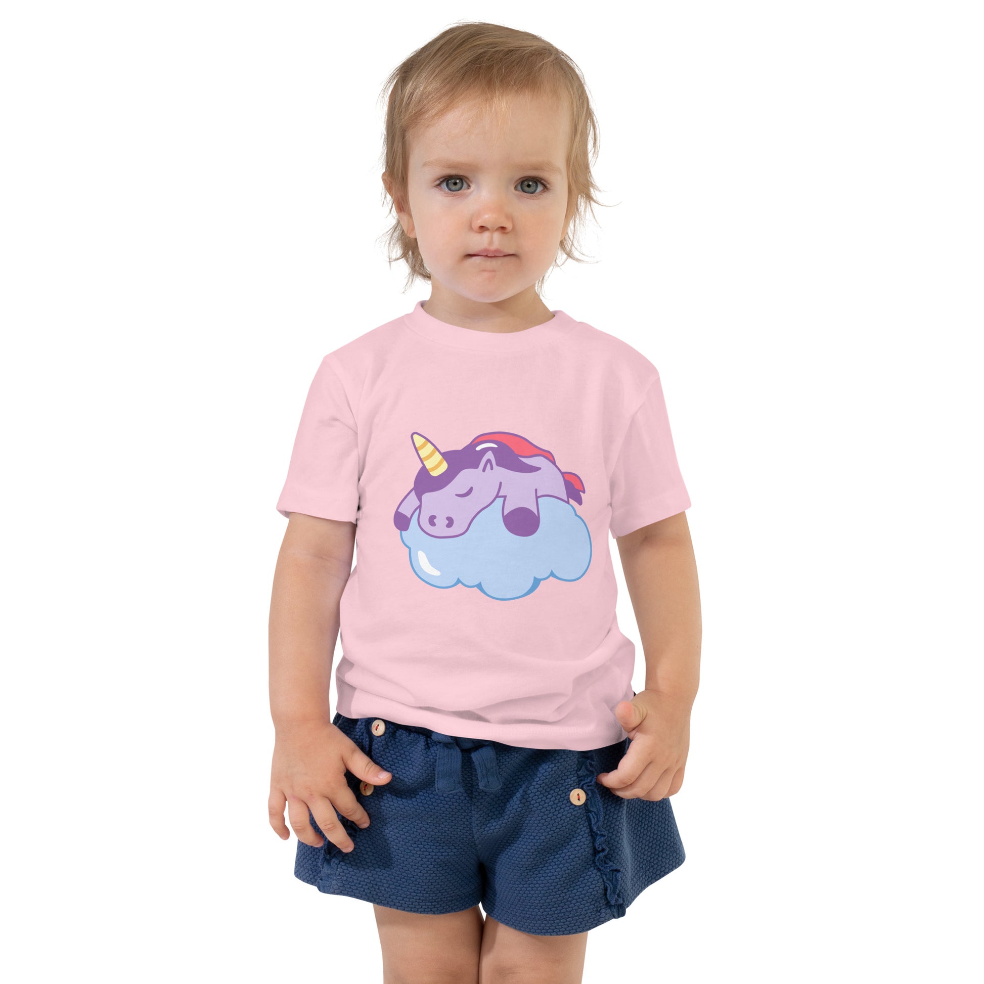 Toddler with a pink T-shirt with a print of a sleeping unicorn on a cloud
