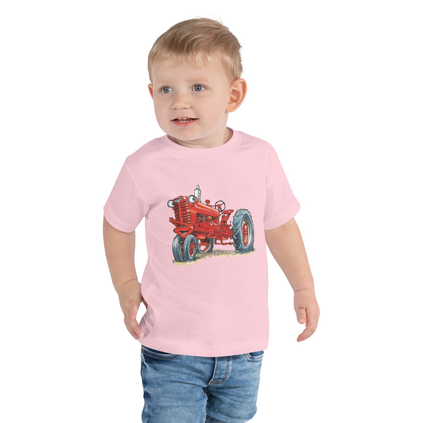 Baby with pink body and a print of a red tractor