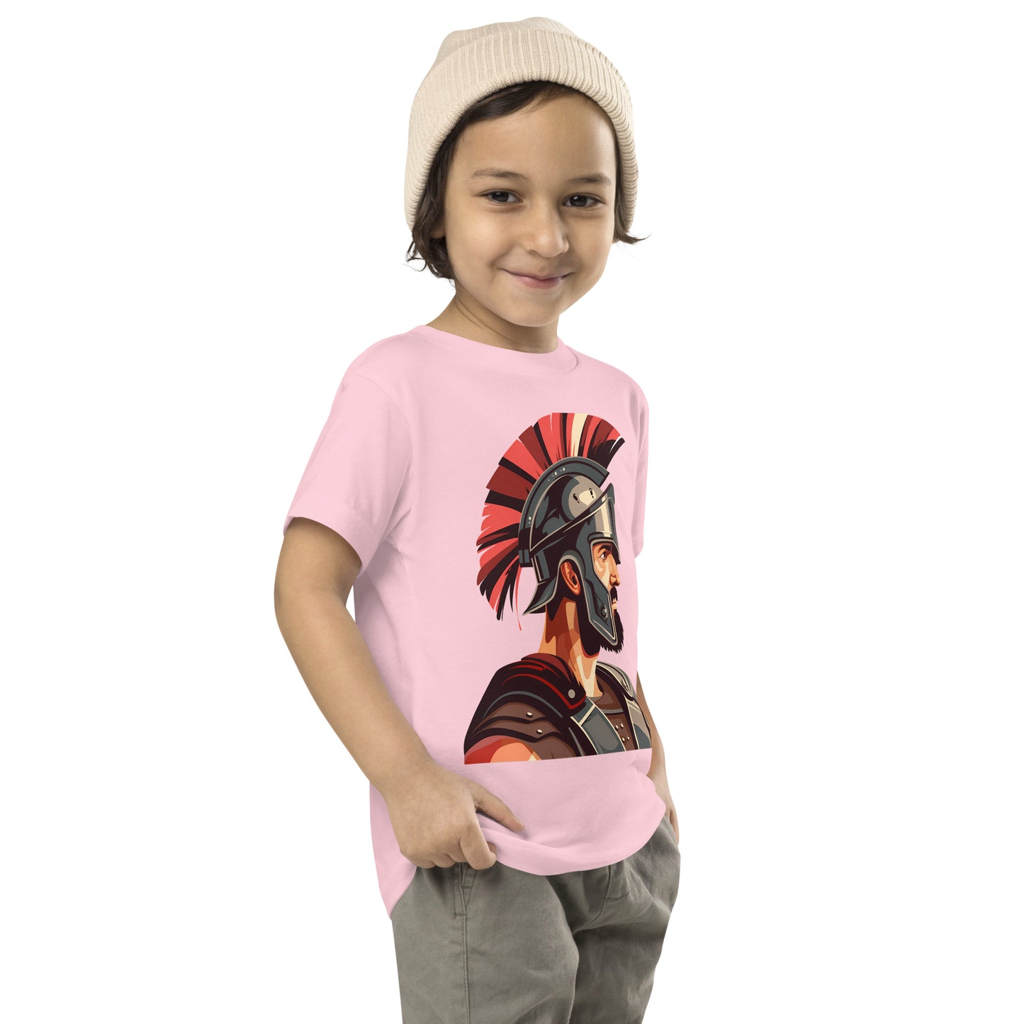 Toddler with a pink T-shirt with a print of a warrior