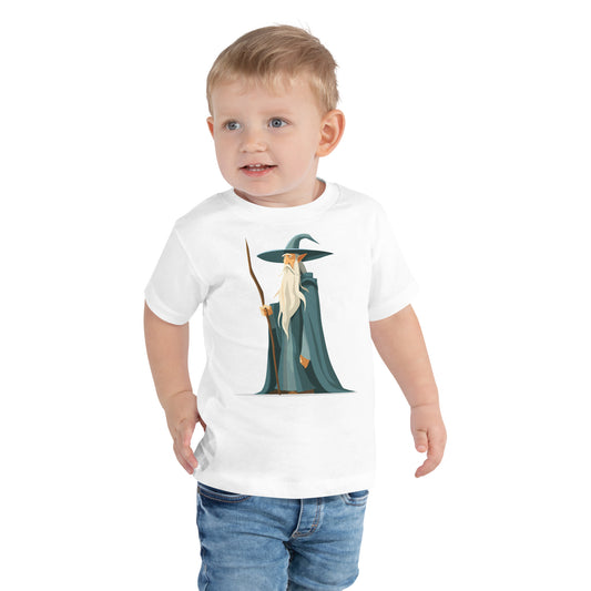 Toddler with a white T-shirt with a picture of a magician