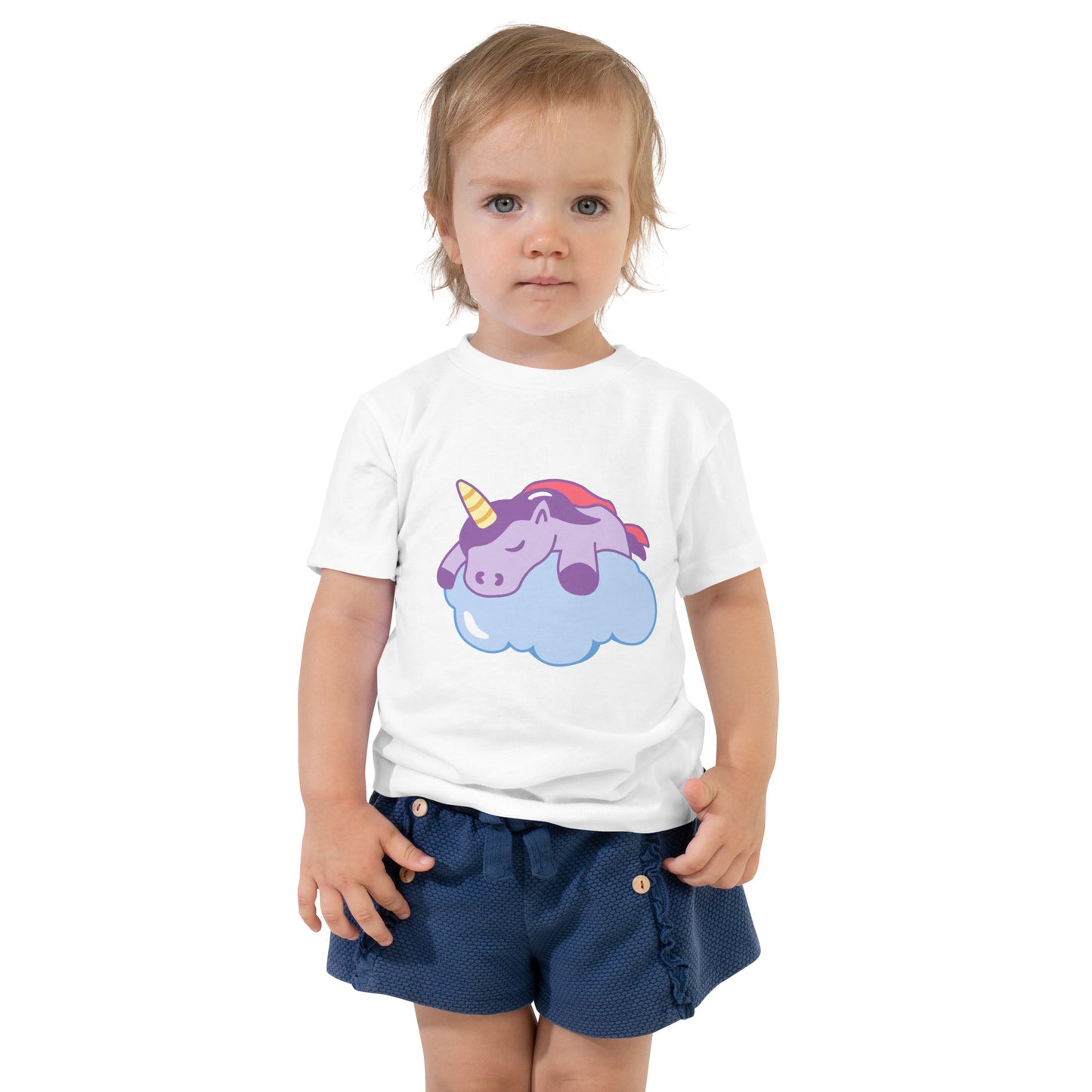 Toddler with a white T-shirt with a print of a sleeping unicorn on a cloud