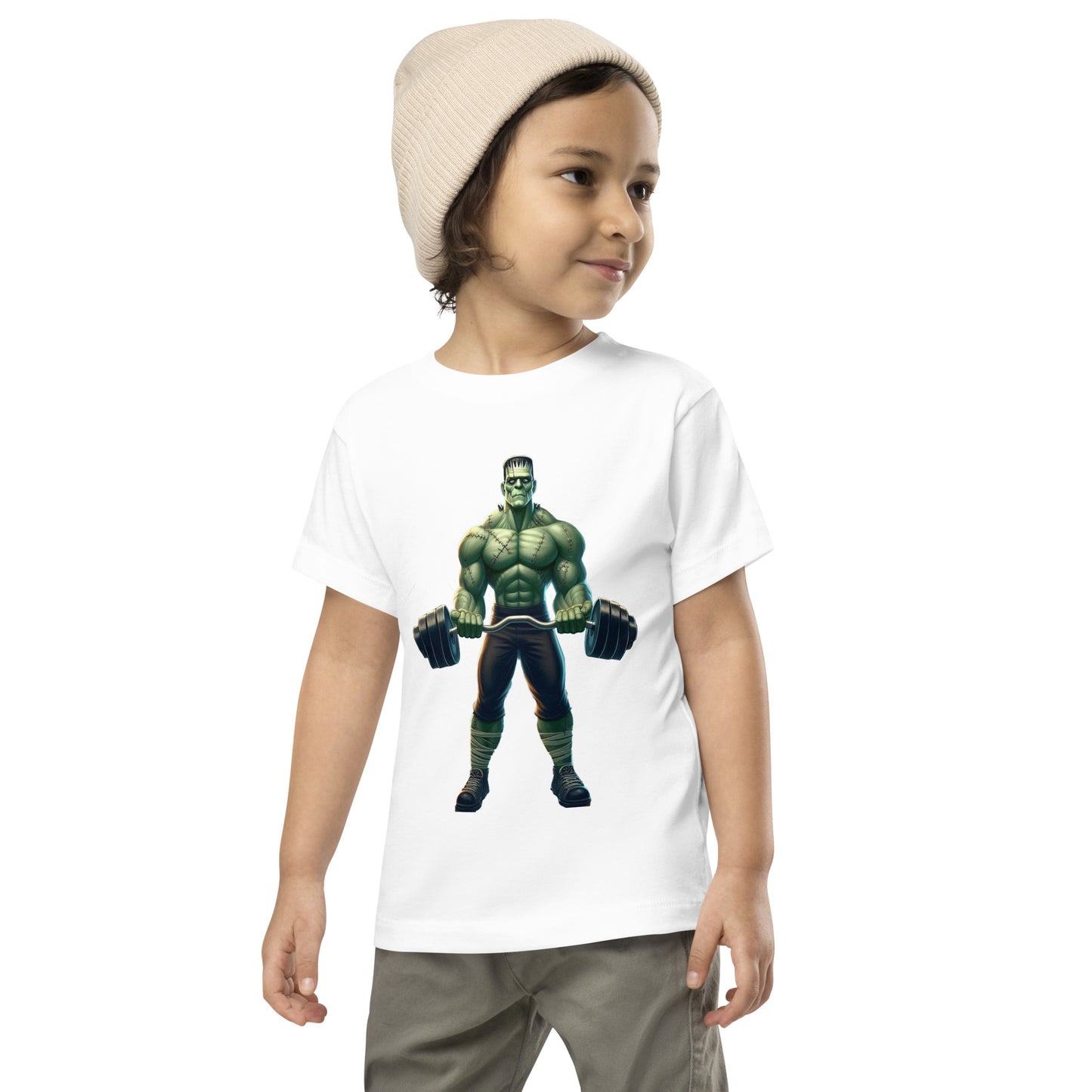Toddler with white T-shirt with a print of a bodybuilder
