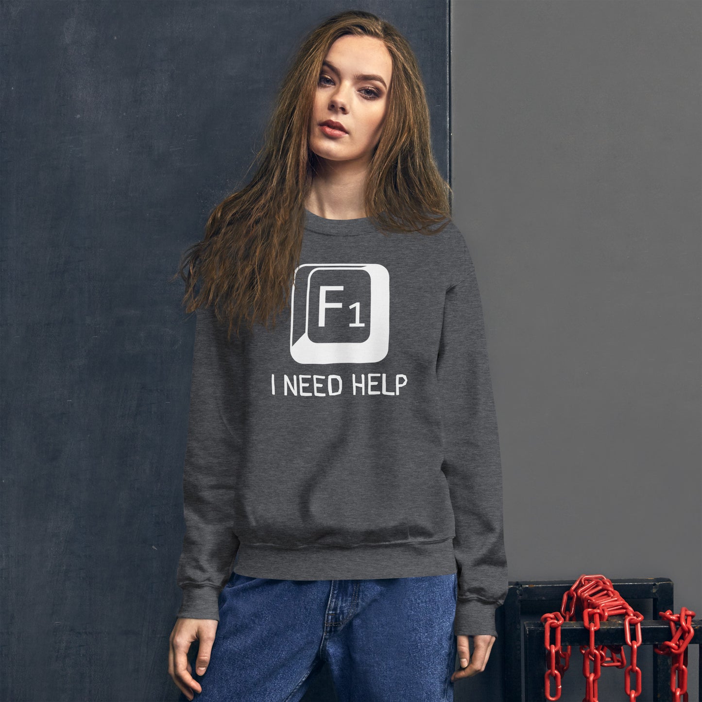 Women with dark heather sweatshirt and a picture of F1 key with text "I need help"