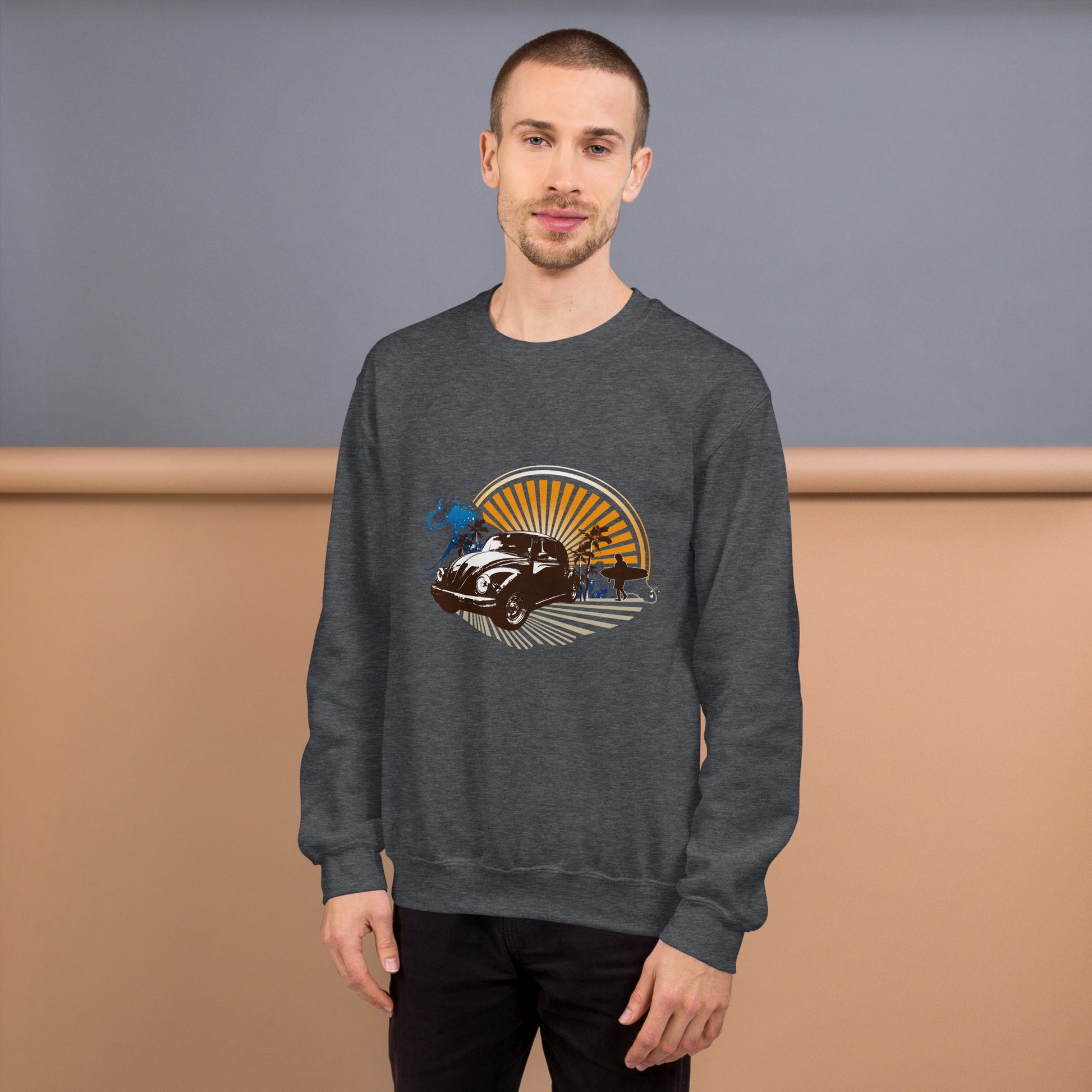Men with dark grey sweatshirt with sunset and beetle car