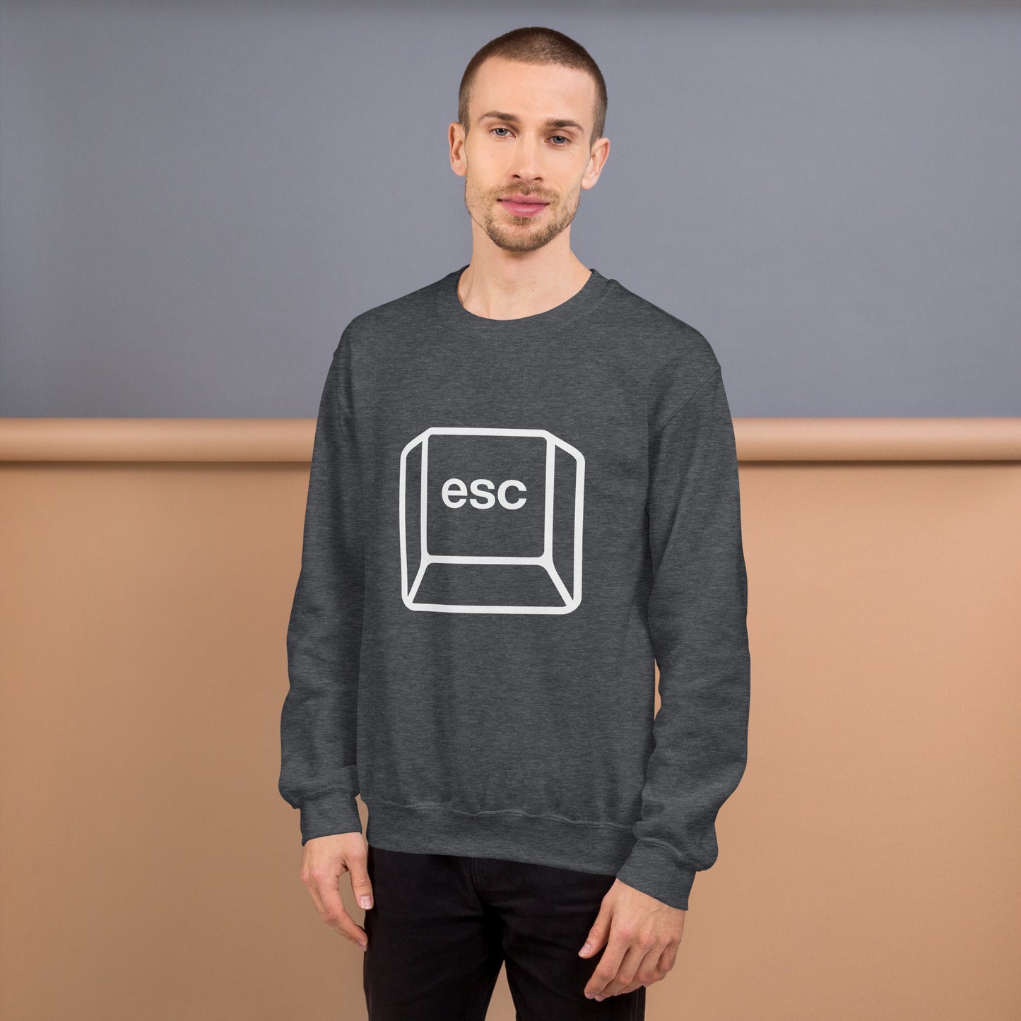 Man with dark grey sweatshirt with picture of esc key