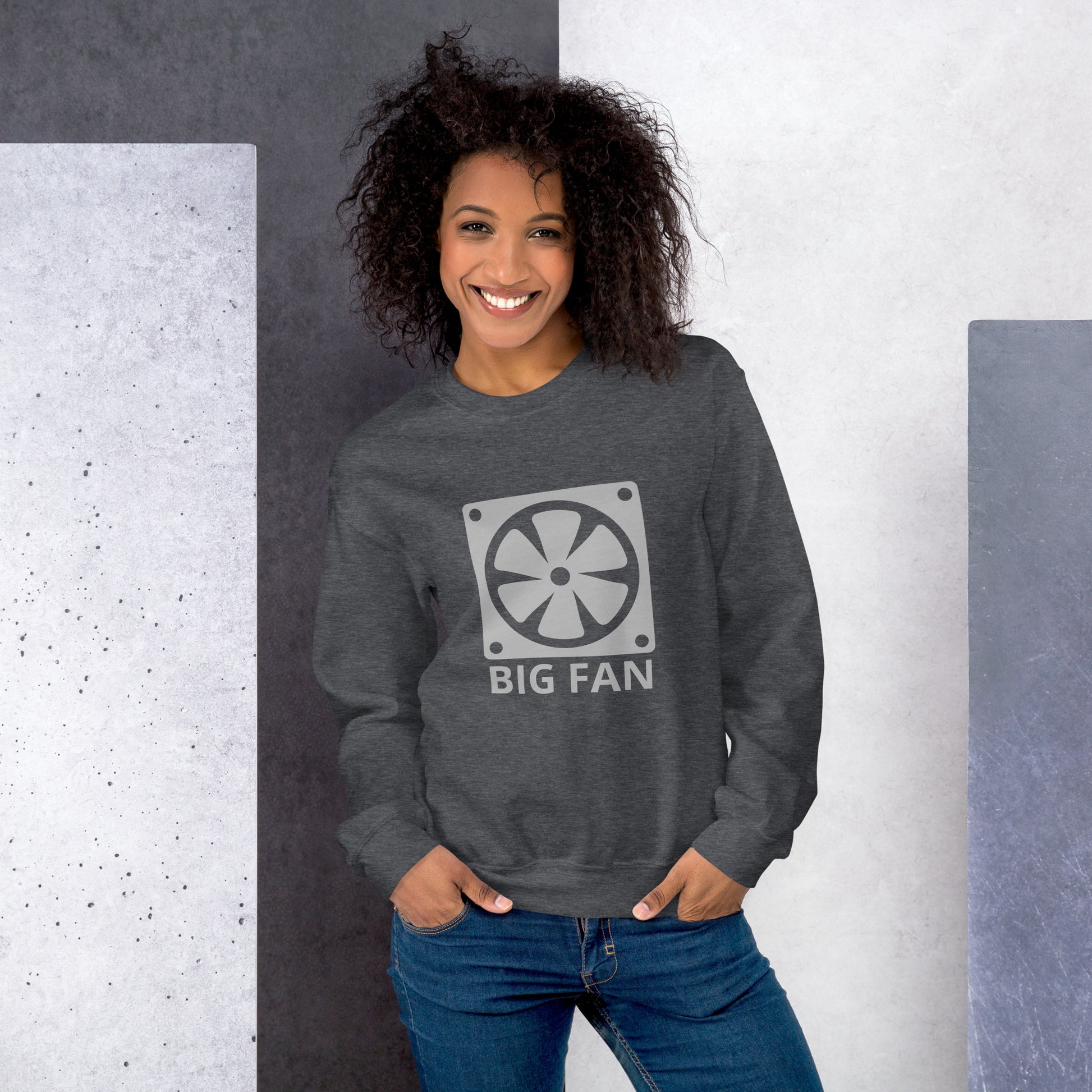 Women with dark grey sweatshirt with image of a big computer fan and the text "BIG FAN"