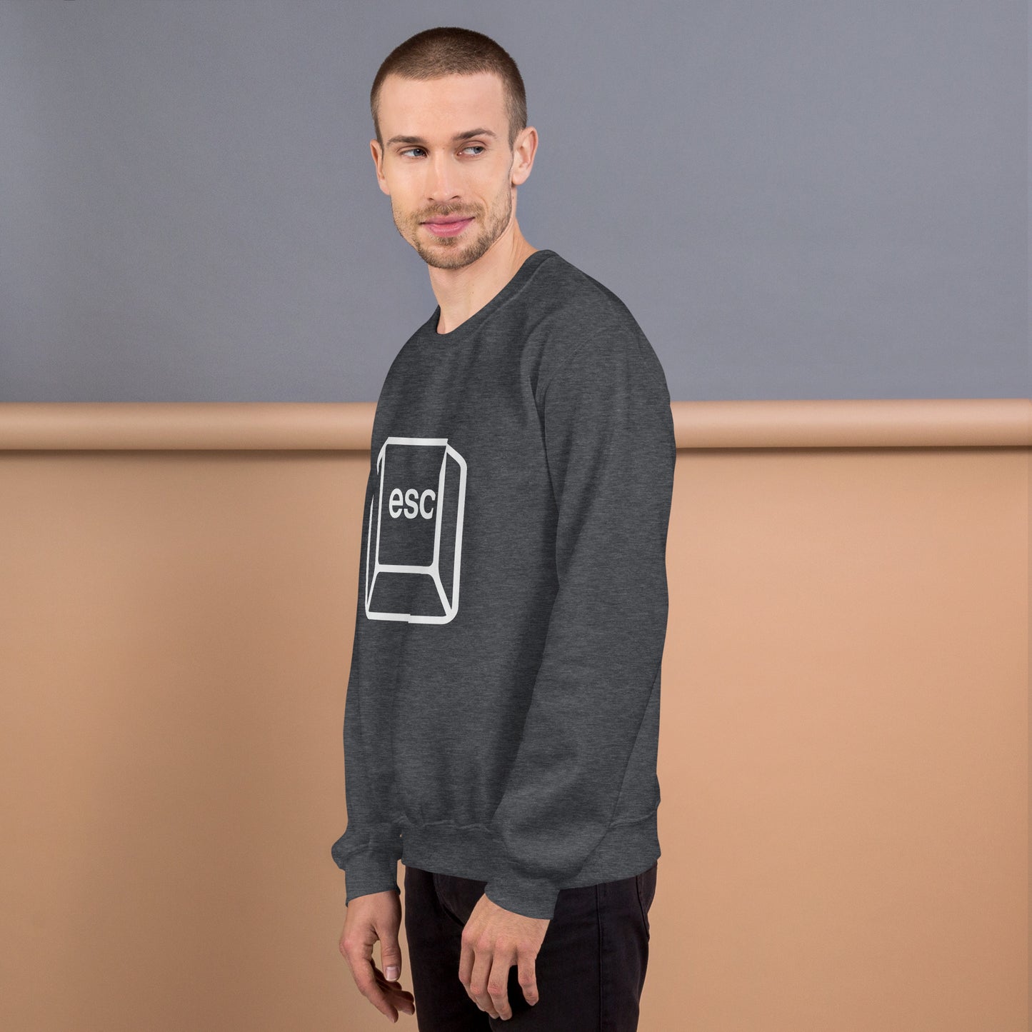 Man with dark grey sweatshirt with picture of esc key
