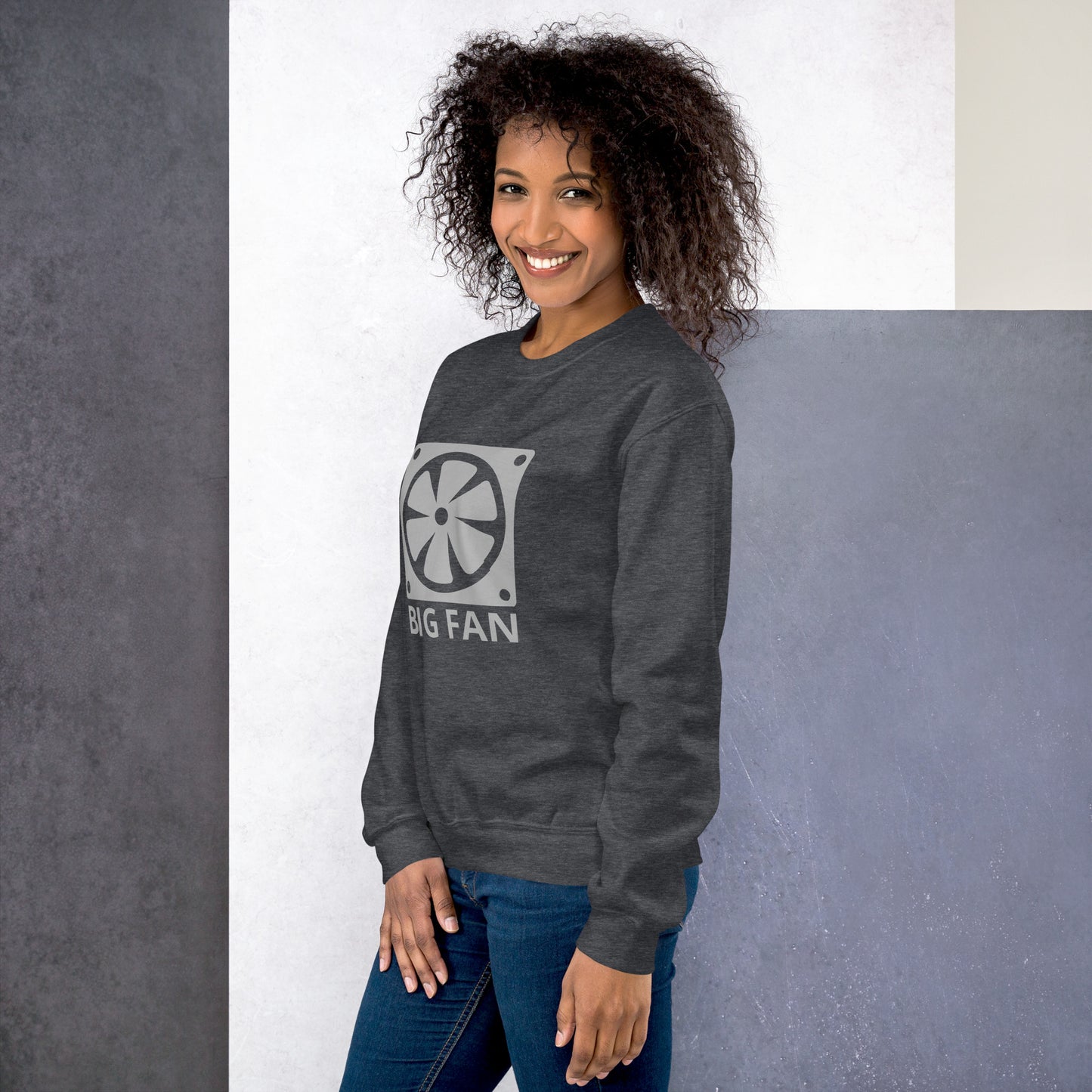 Women with dark grey sweatshirt with image of a big computer fan and the text "BIG FAN"