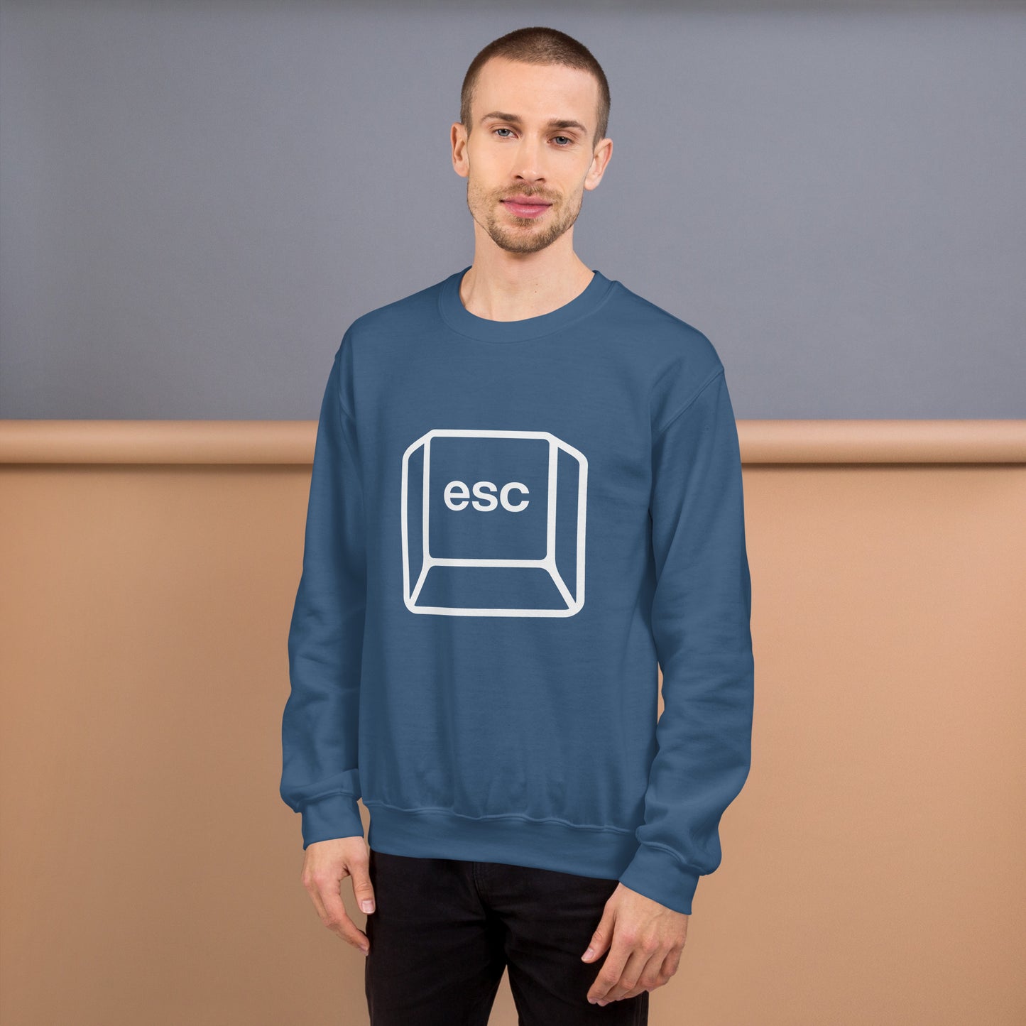 Man with indigo blue sweatshirt with picture of esc key