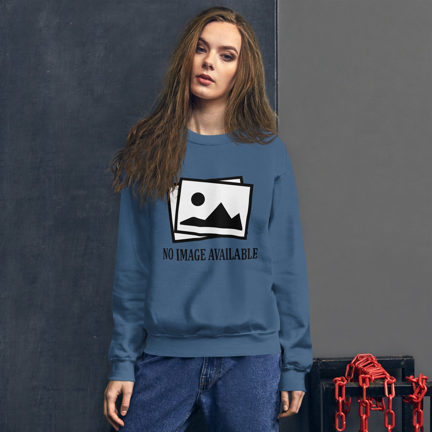 Women with indigo blue sweatshirt with image and text "no image available"
