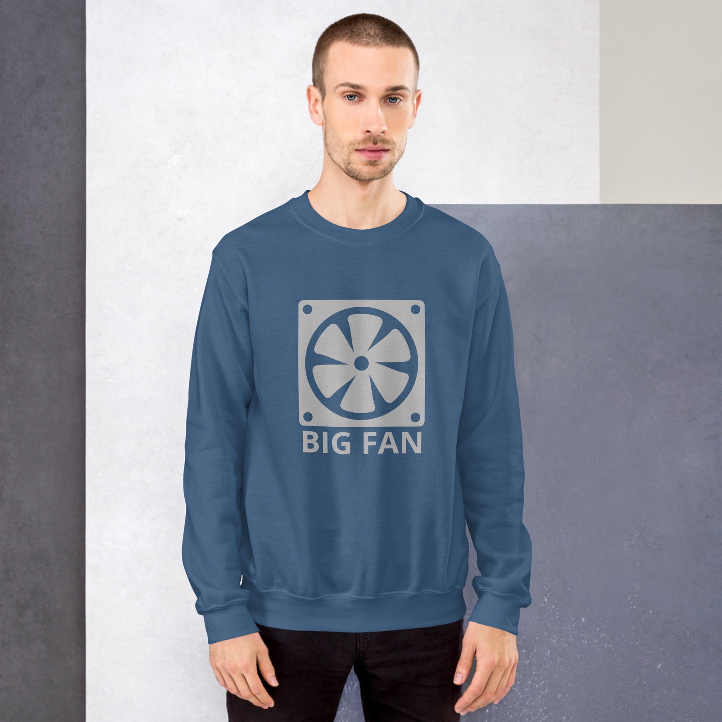 Men with indigo blue sweatshirt with image of a big computer fan and the text "BIG FAN"