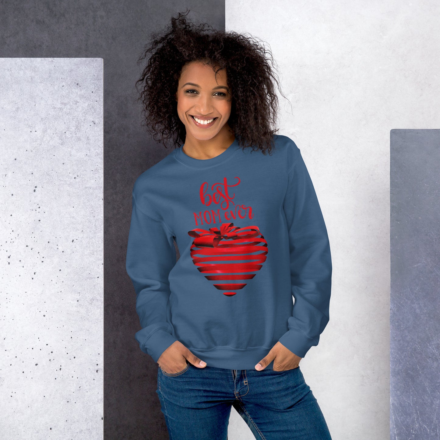 Women with indigo blue sweater with red text best MOM Ever and red heart