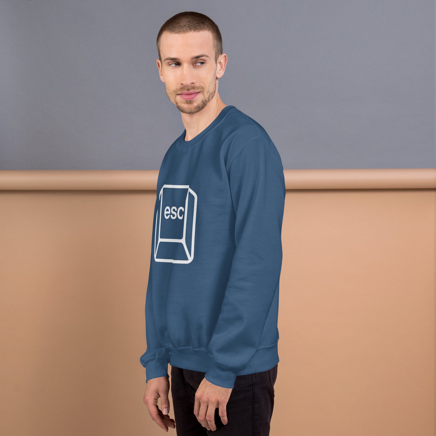 Man with indigo blue sweatshirt with picture of esc key