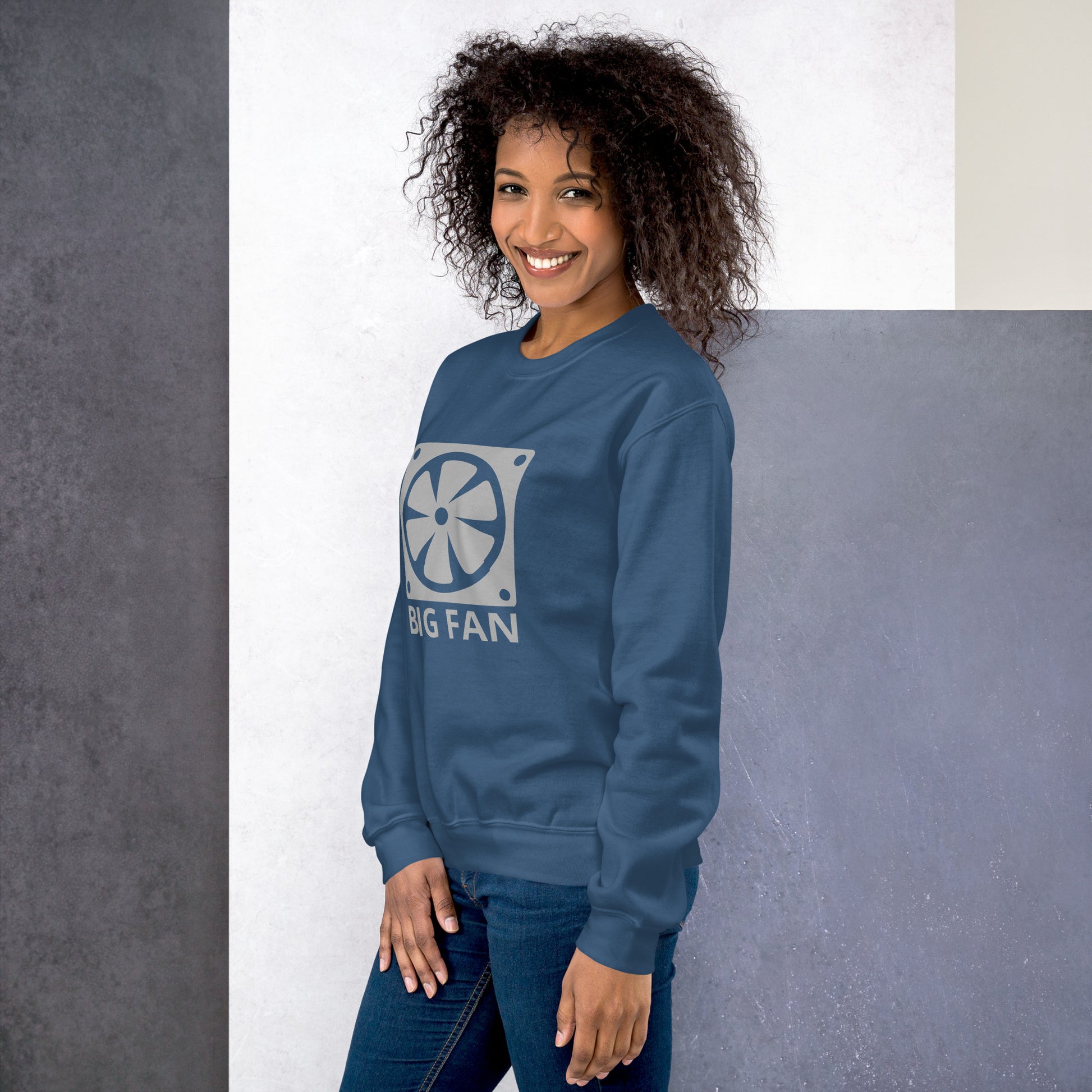 Women with indigo blue sweatshirt with image of a big computer fan and the text "BIG FAN"