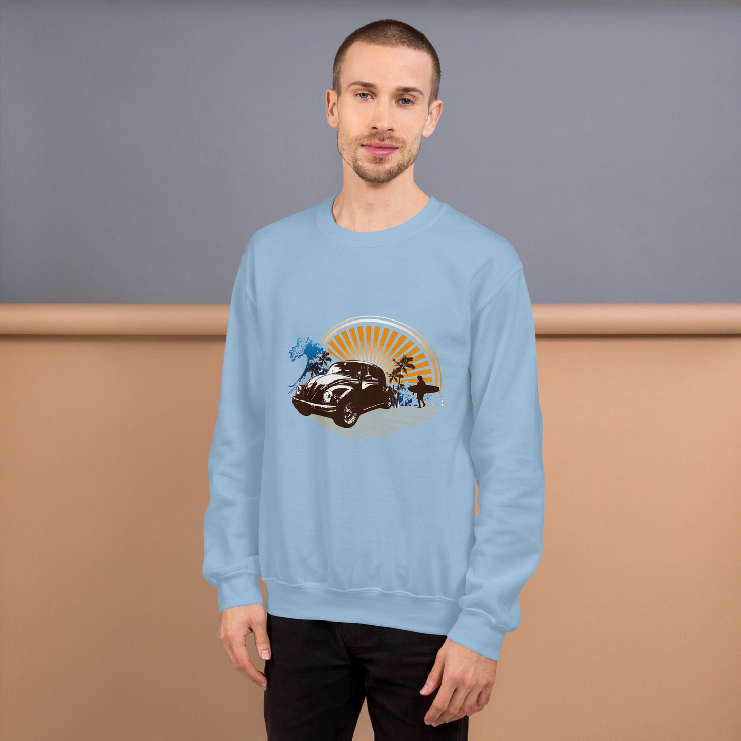 Men with light blue sweatshirt with sunset and beetle car