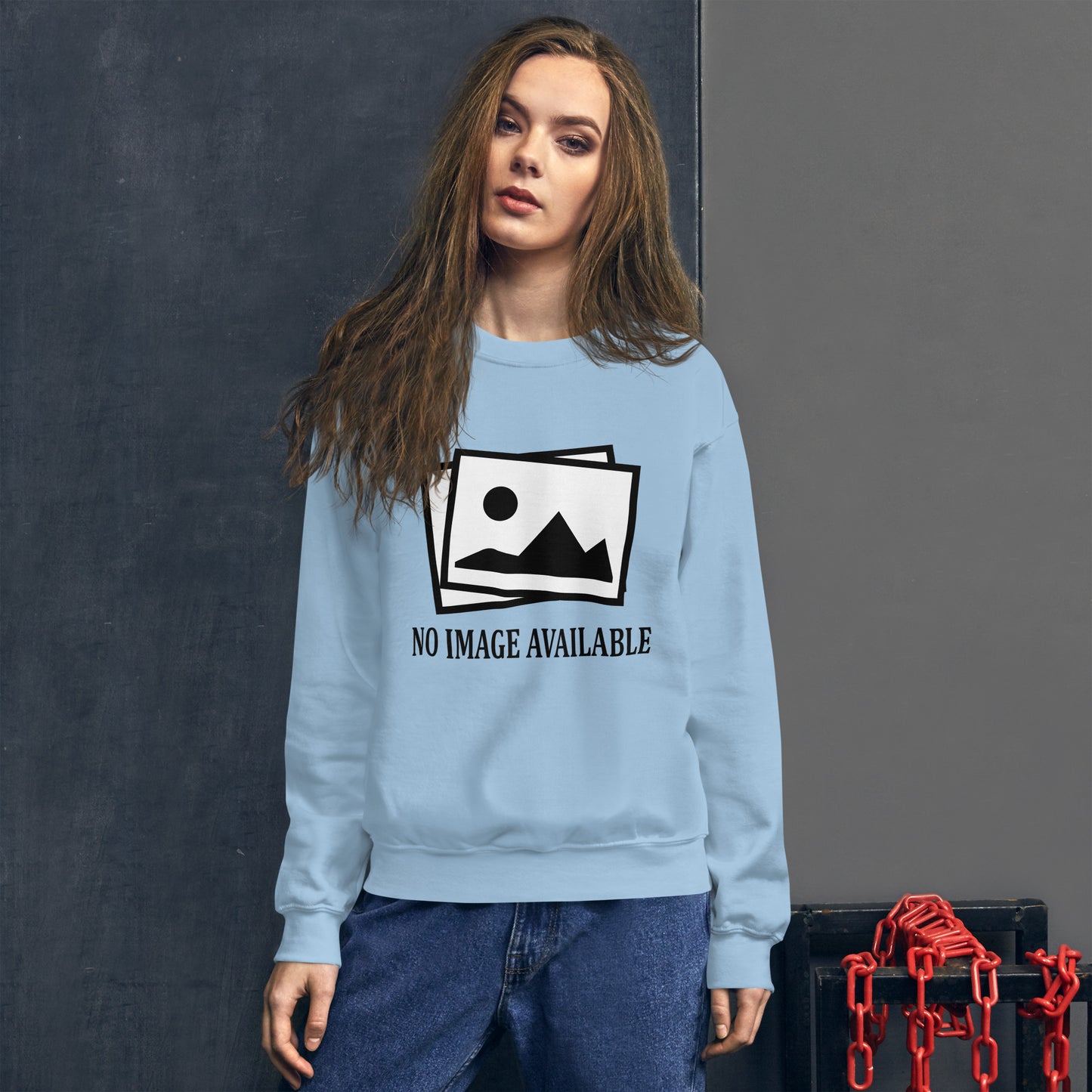 Women with light blue sweatshirt with image and text "no image available"