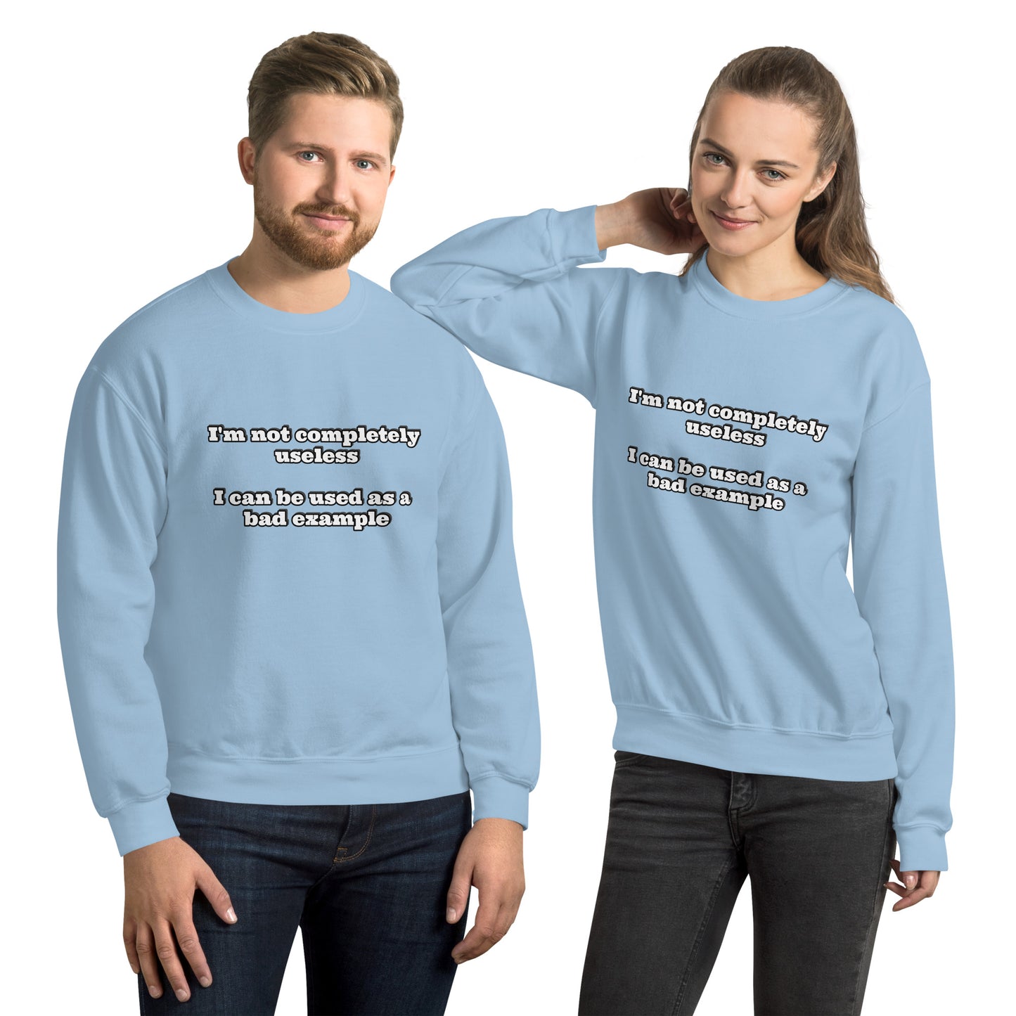 Man and women with light blue sweatshirt with text “I'm not completely useless I can be used as a bad example”