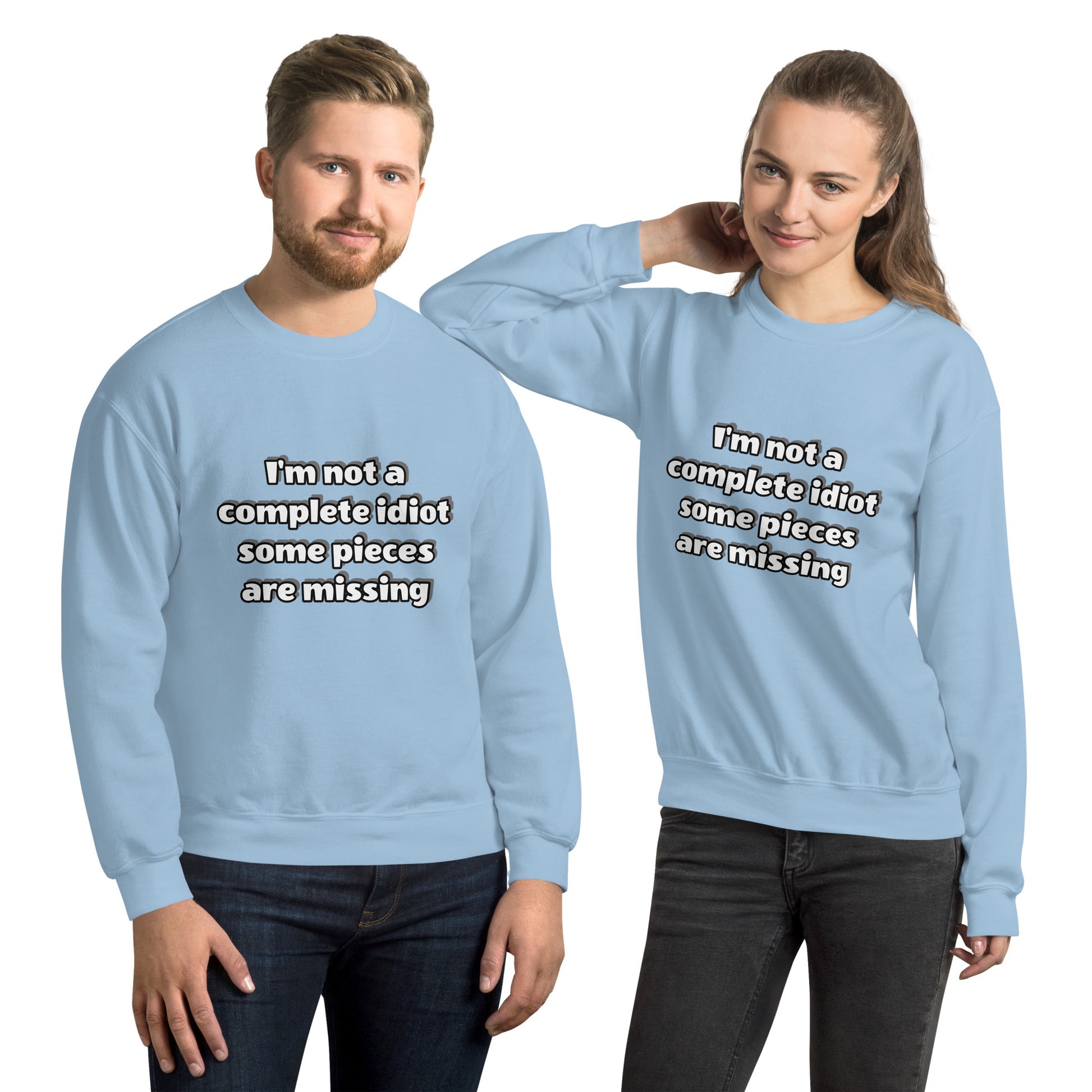 Man and women with light blue sweatshirt with text “I’m not a complete idiot, some pieces are missing”
