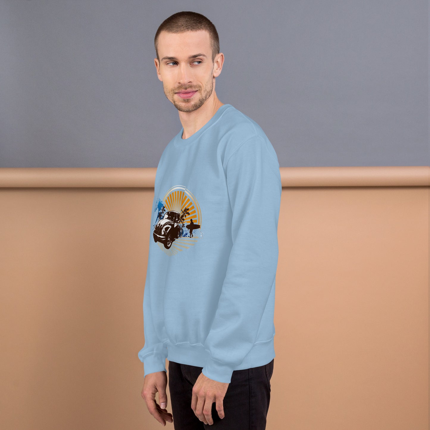 Men with light blue sweatshirt with sunset and beetle car