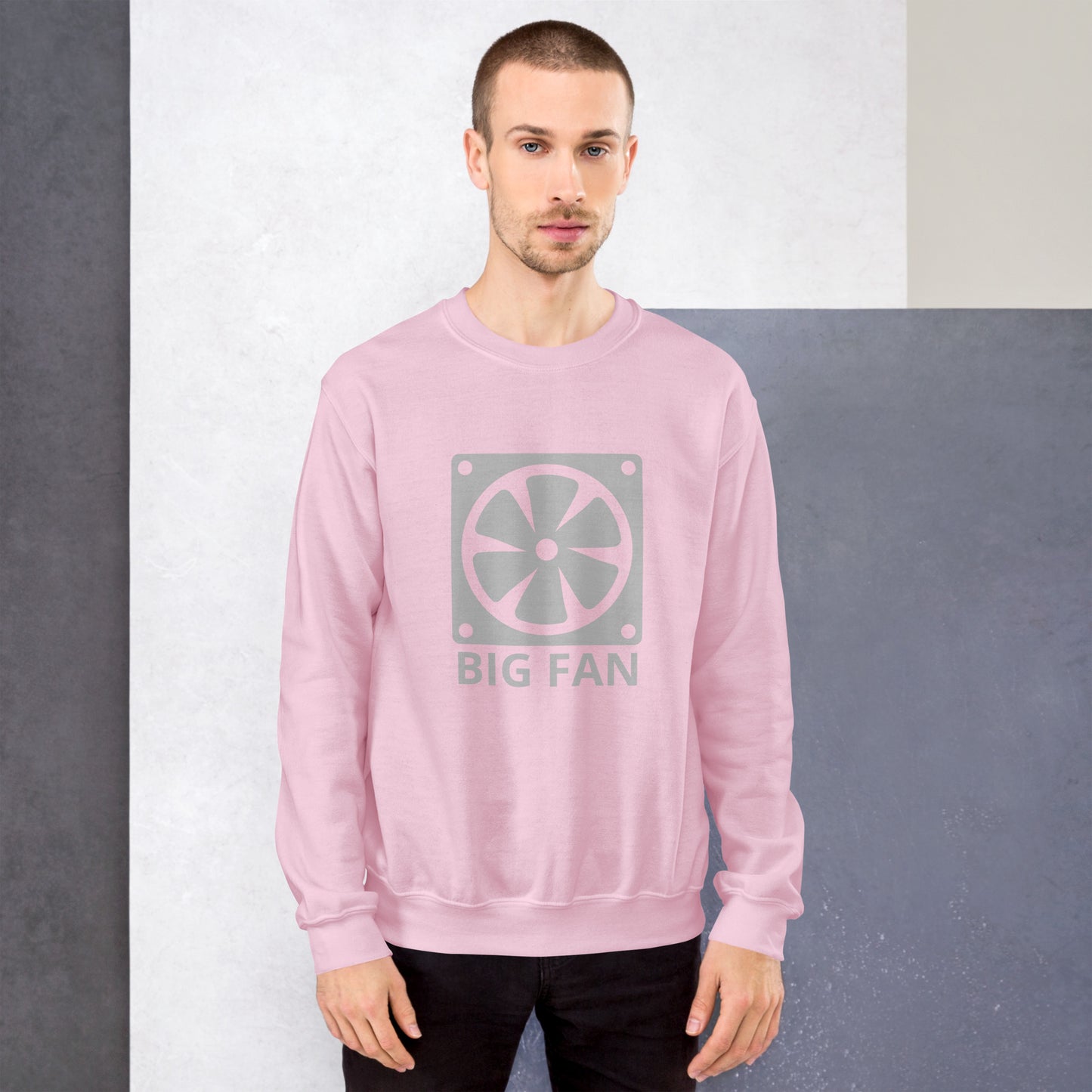 Men with pink sweatshirt with image of a big computer fan and the text "BIG FAN"