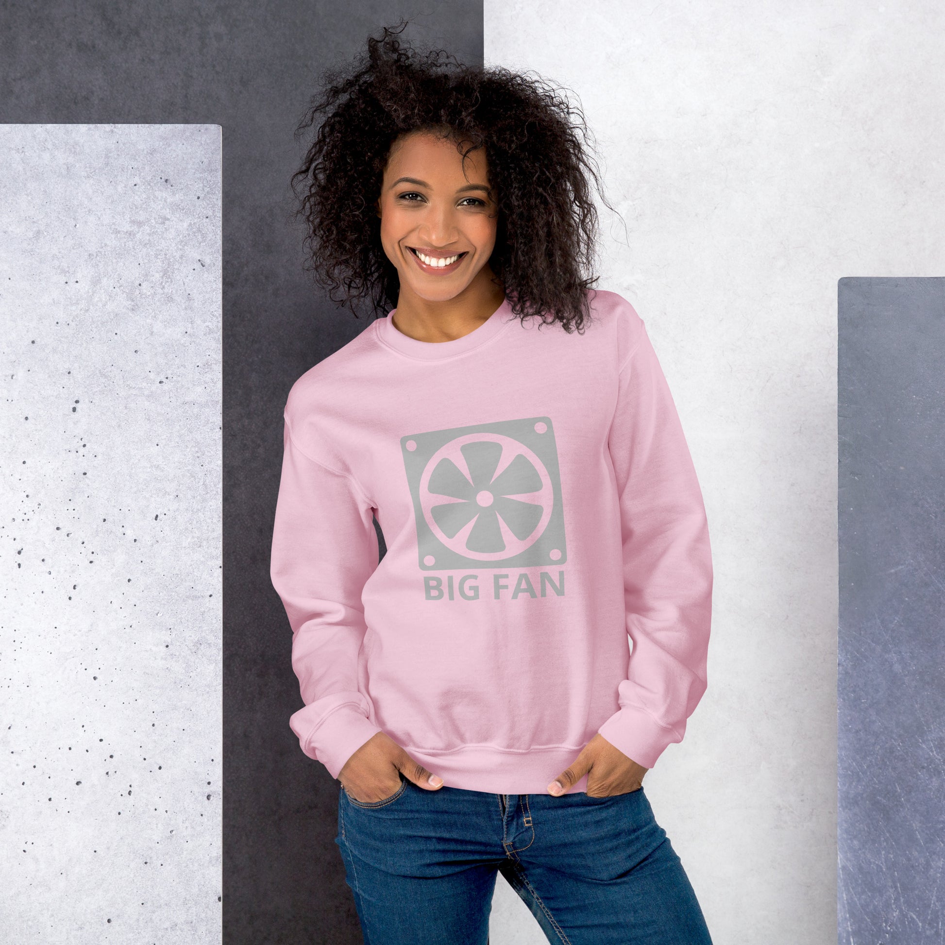 Women with pink sweatshirt with image of a big computer fan and the text "BIG FAN"