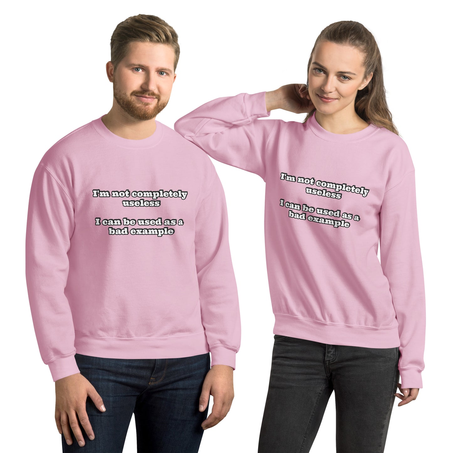 Man and women with pink sweatshirt with text “I'm not completely useless I can be used as a bad example”