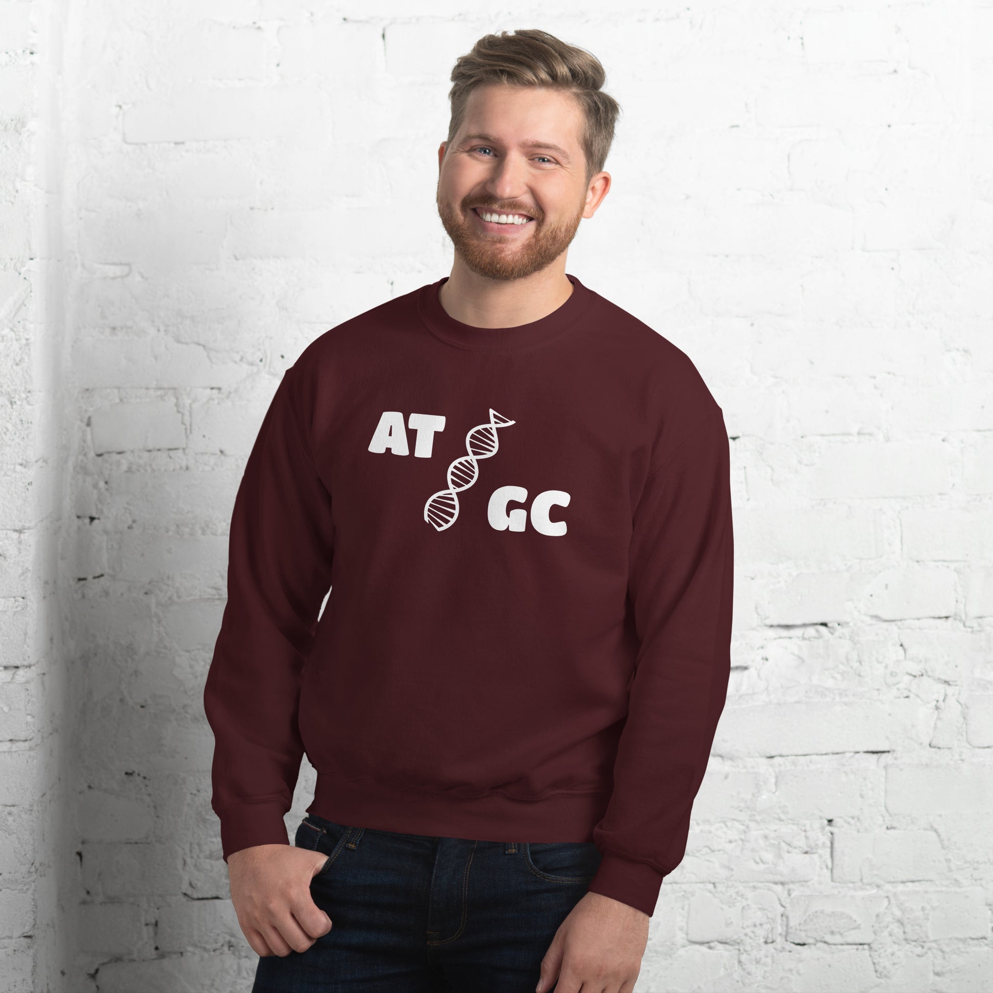 Men with maroon sweatshirt with image of a DNA string and the text "ATGC"