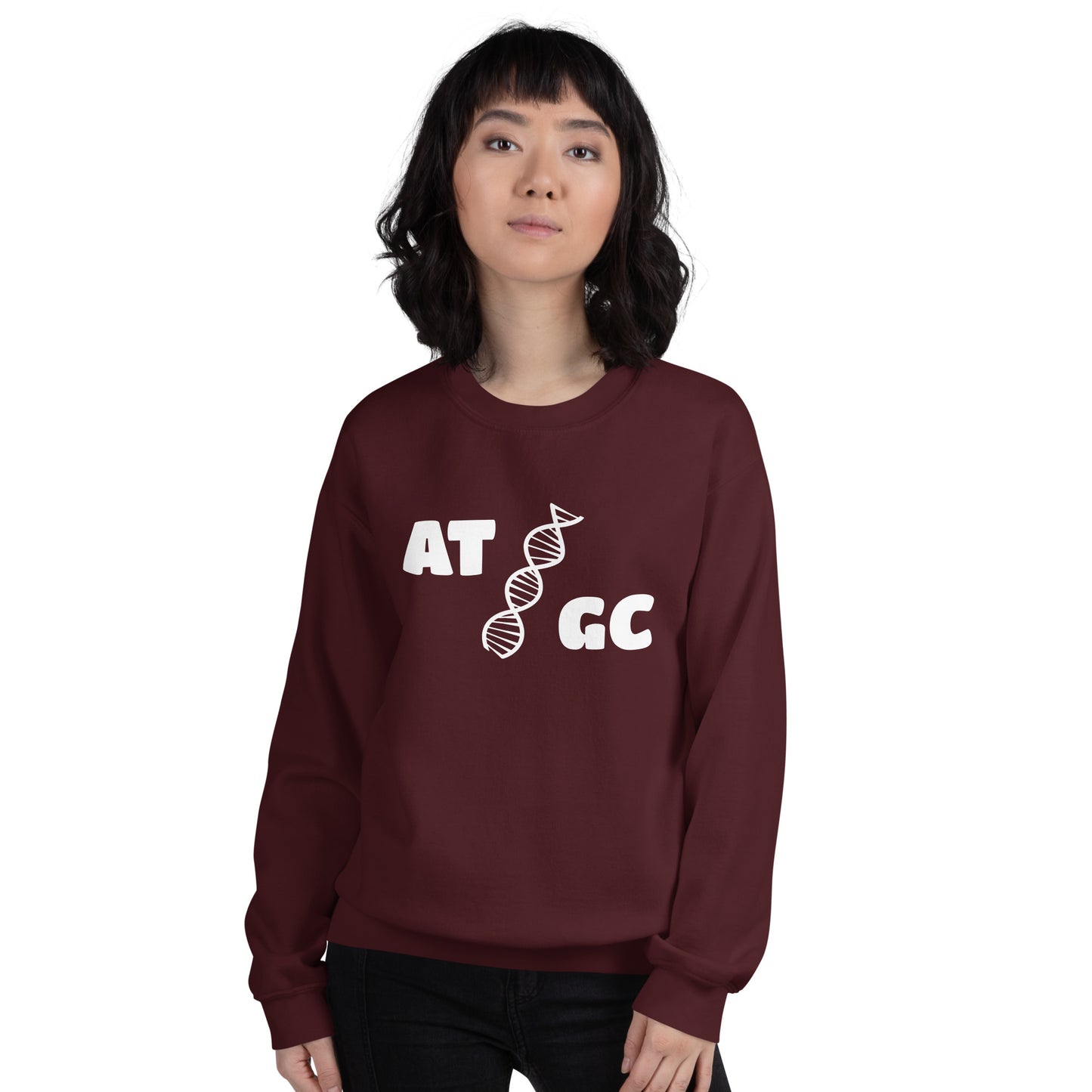 Women with maroon sweatshirt with image of a DNA string and the text "ATGC"