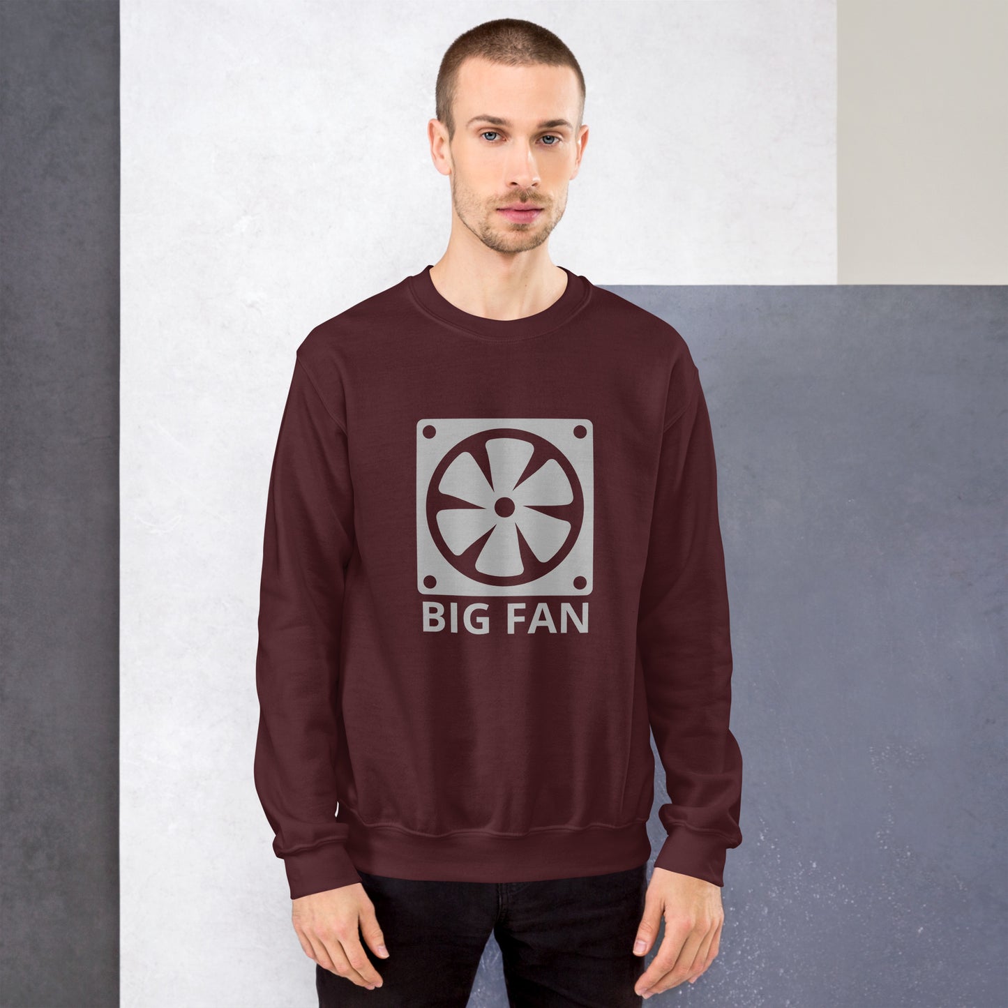 Men with maroon sweatshirt with image of a big computer fan and the text "BIG FAN"