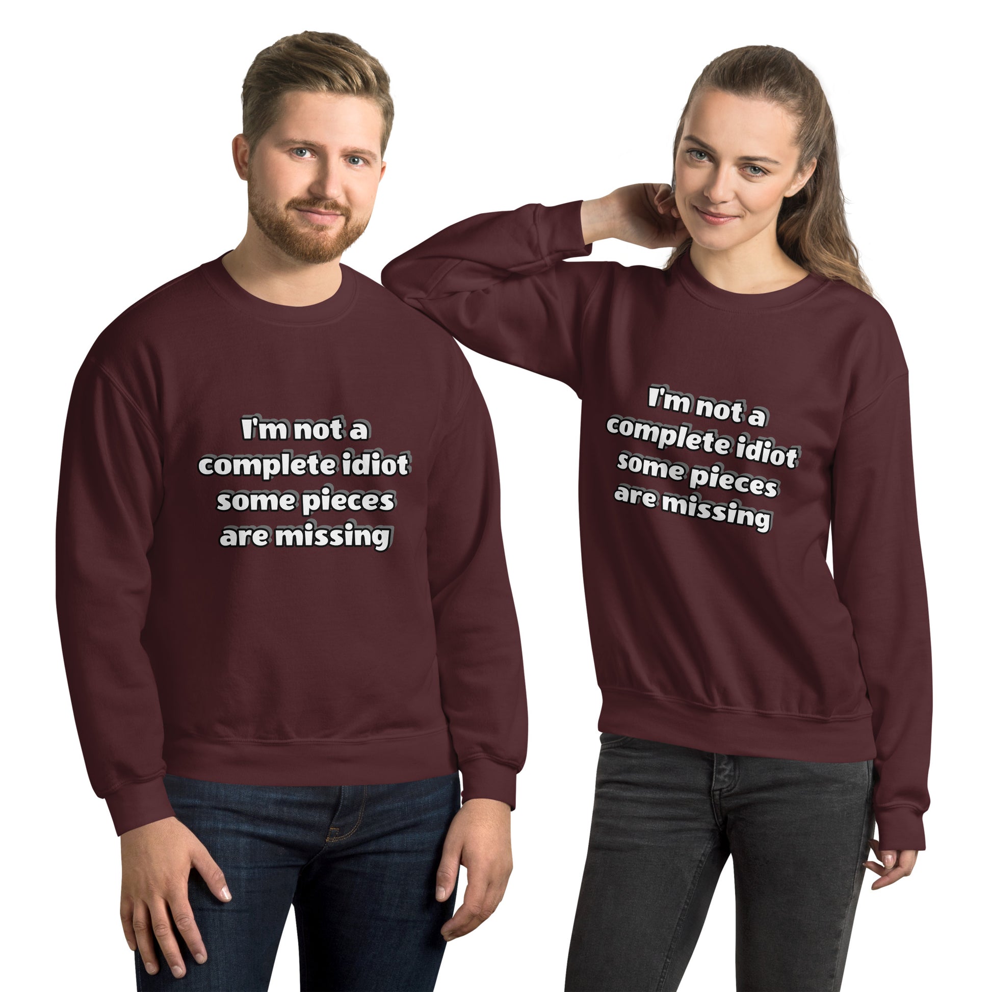 Man and women with maroon sweatshirt with text “I’m not a complete idiot, some pieces are missing”