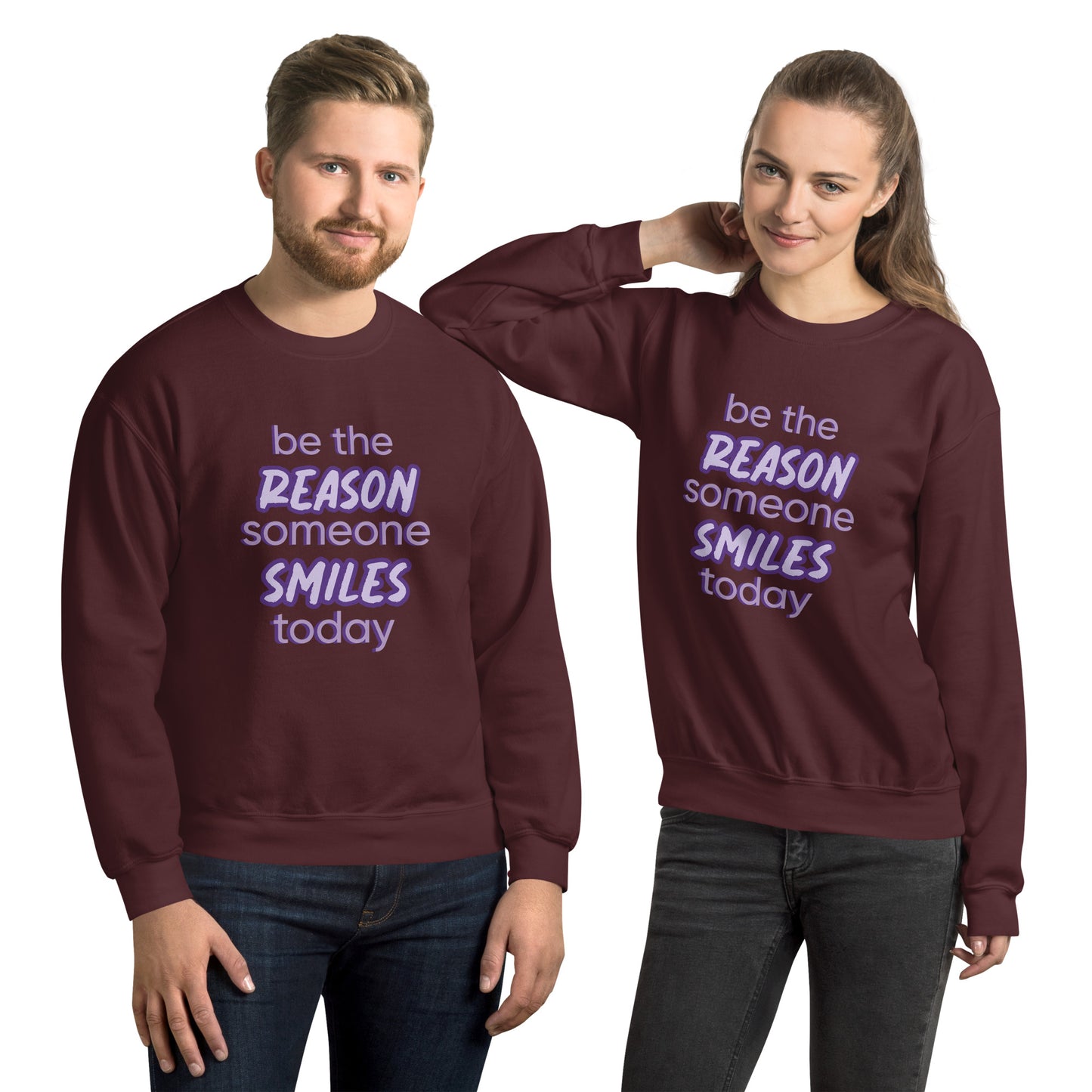 Men and women with maroon sweater and the quote "be the reason someone smiles today" in purple on it.