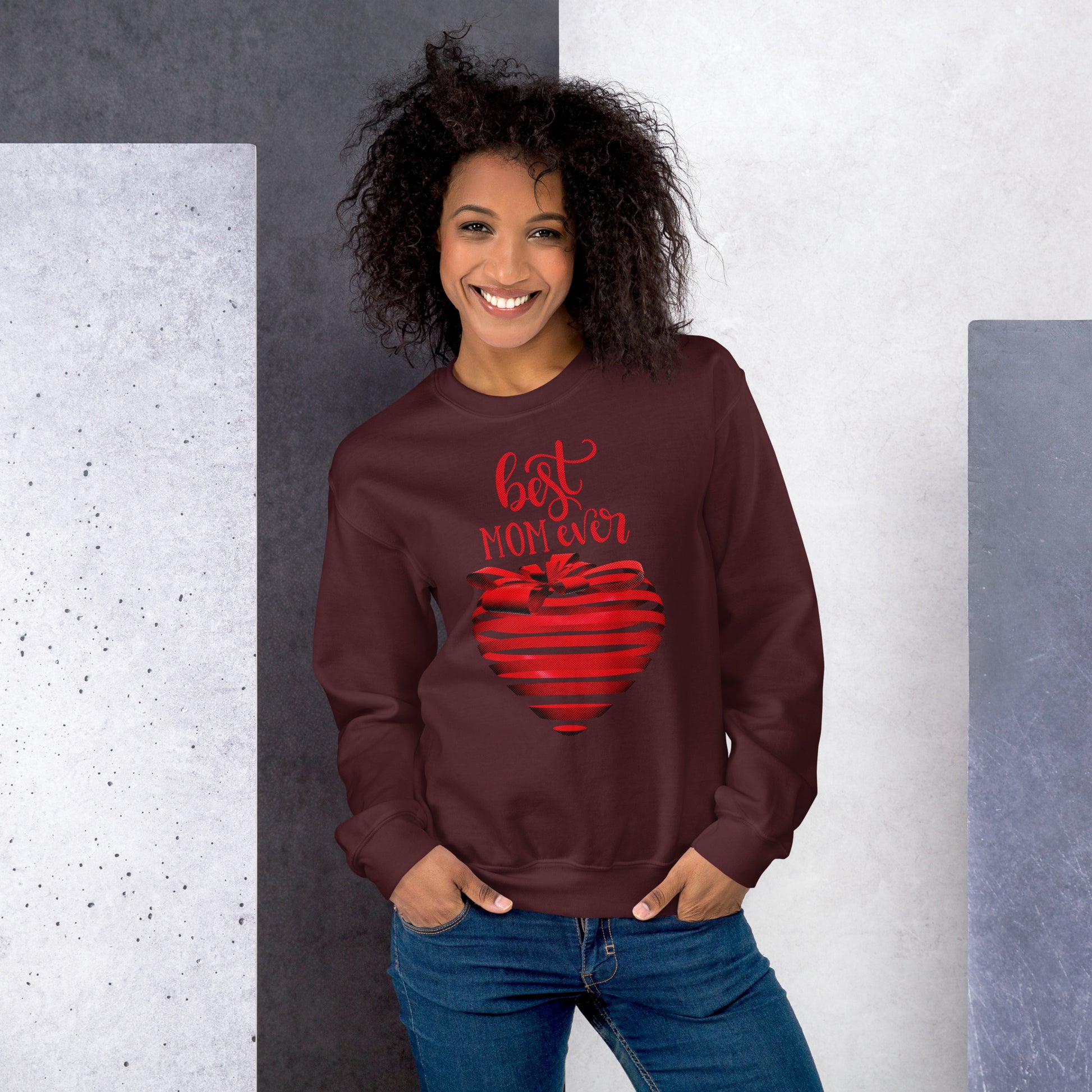 Women with maroon sweater with red text best MOM Ever and red heart