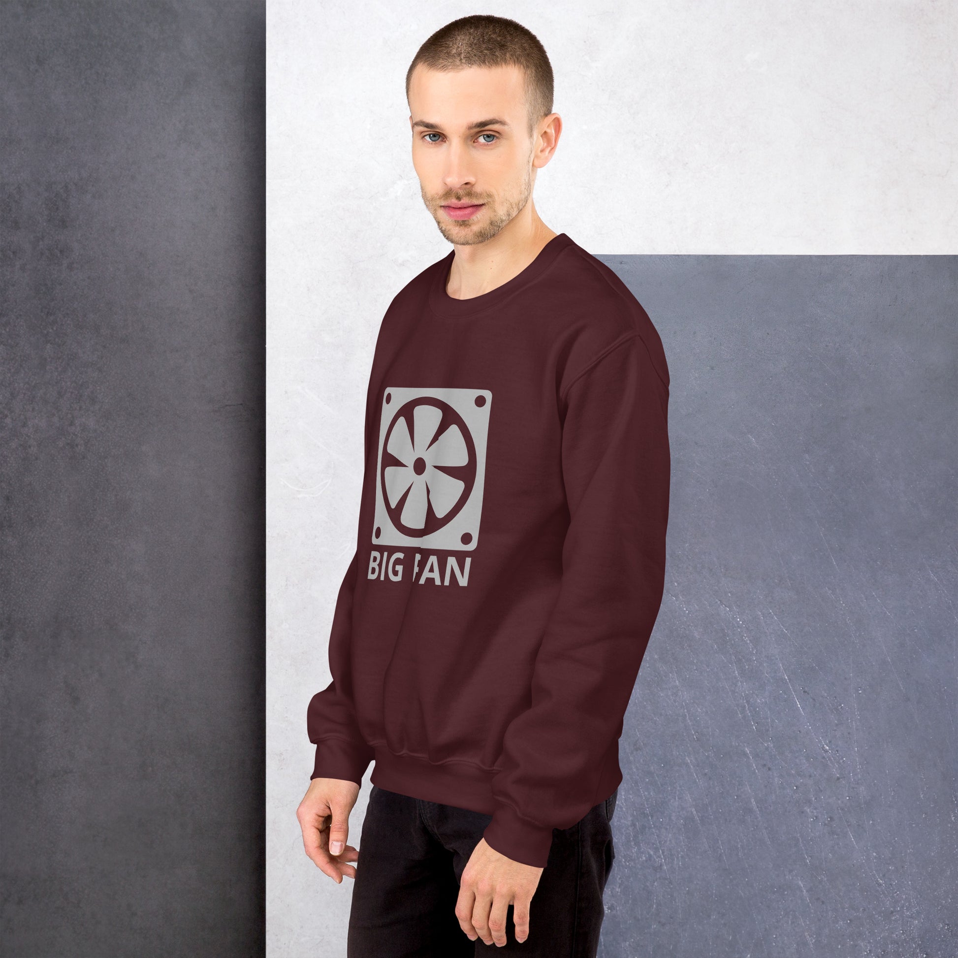 Men with maroon sweatshirt with image of a big computer fan and the text "BIG FAN"