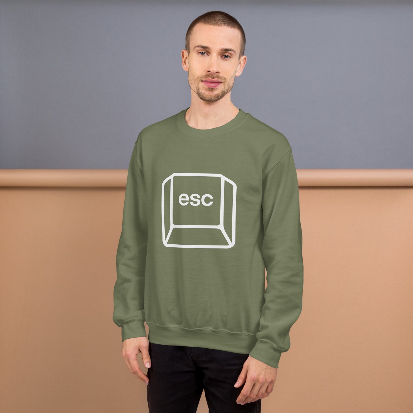 Man with military green sweatshirt with picture of esc key