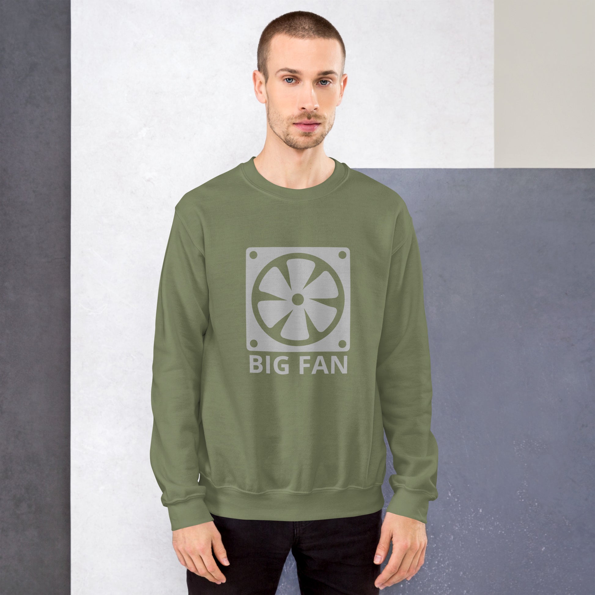 Men with military green sweatshirt with image of a big computer fan and the text "BIG FAN"
