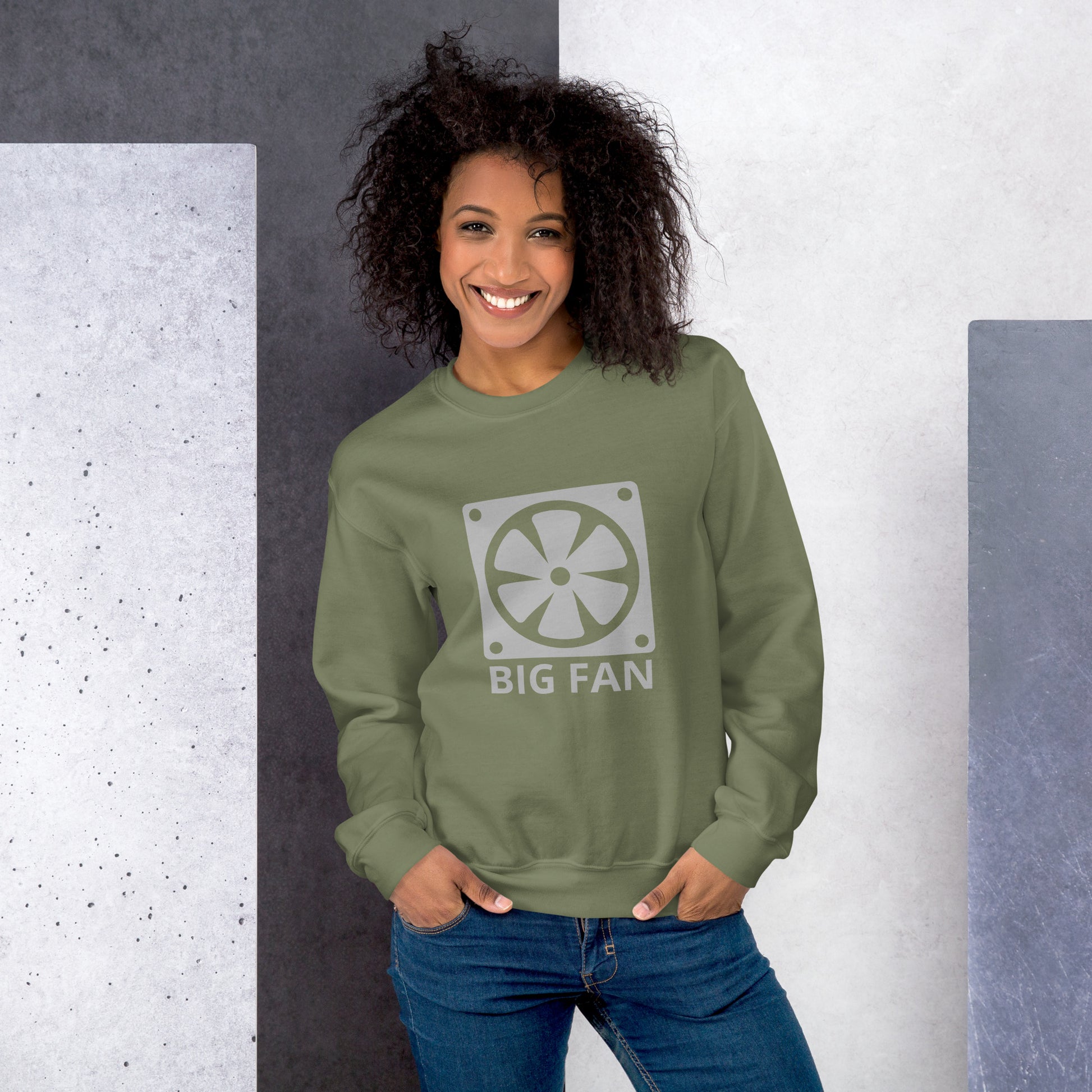 Women with military green sweatshirt with image of a big computer fan and the text "BIG FAN"