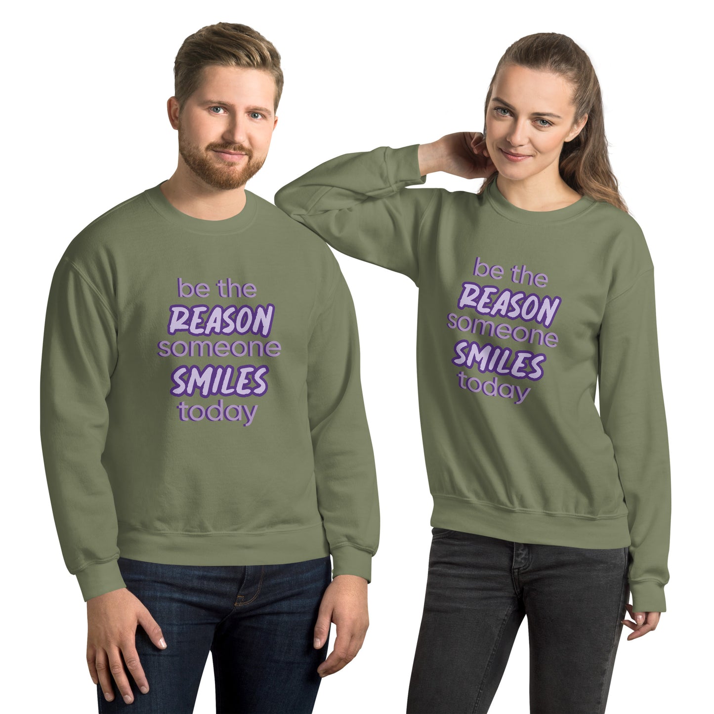Men and women with military green sweater and the quote "be the reason someone smiles today" in purple on it. 