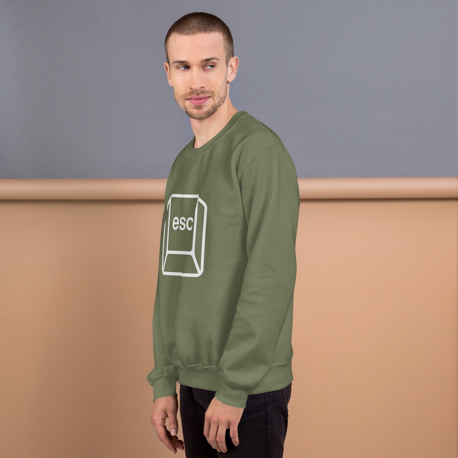 Man with military green sweatshirt with picture of esc key