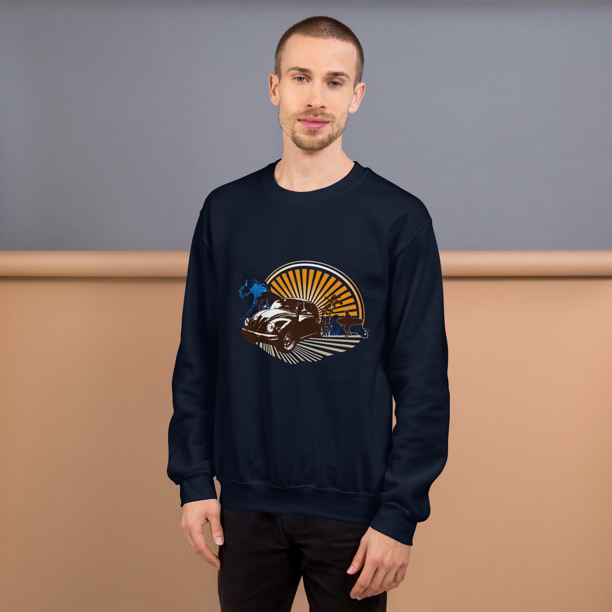 Men with navy blue sweatshirt with sunset and beetle car
