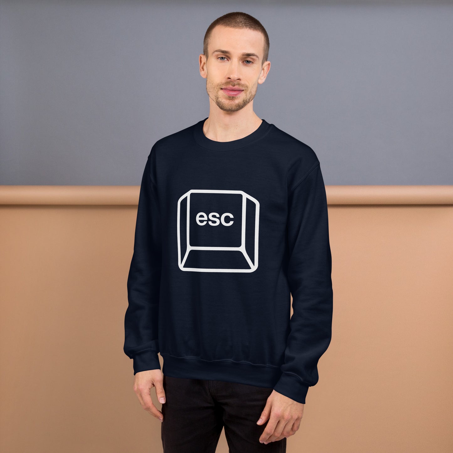Man with navy blue sweatshirt with picture of esc key