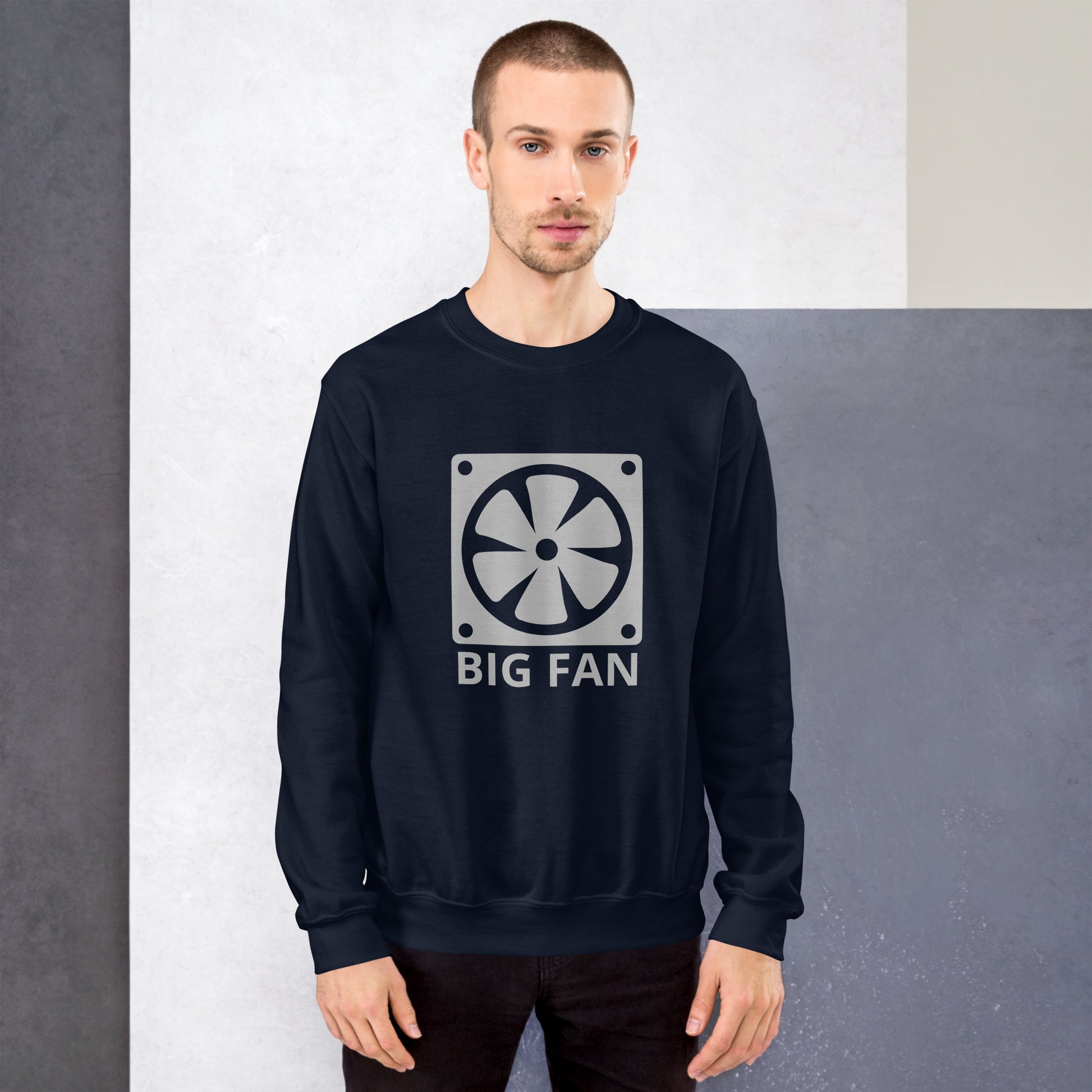 Men with navy blue sweatshirt with image of a big computer fan and the text "BIG FAN"