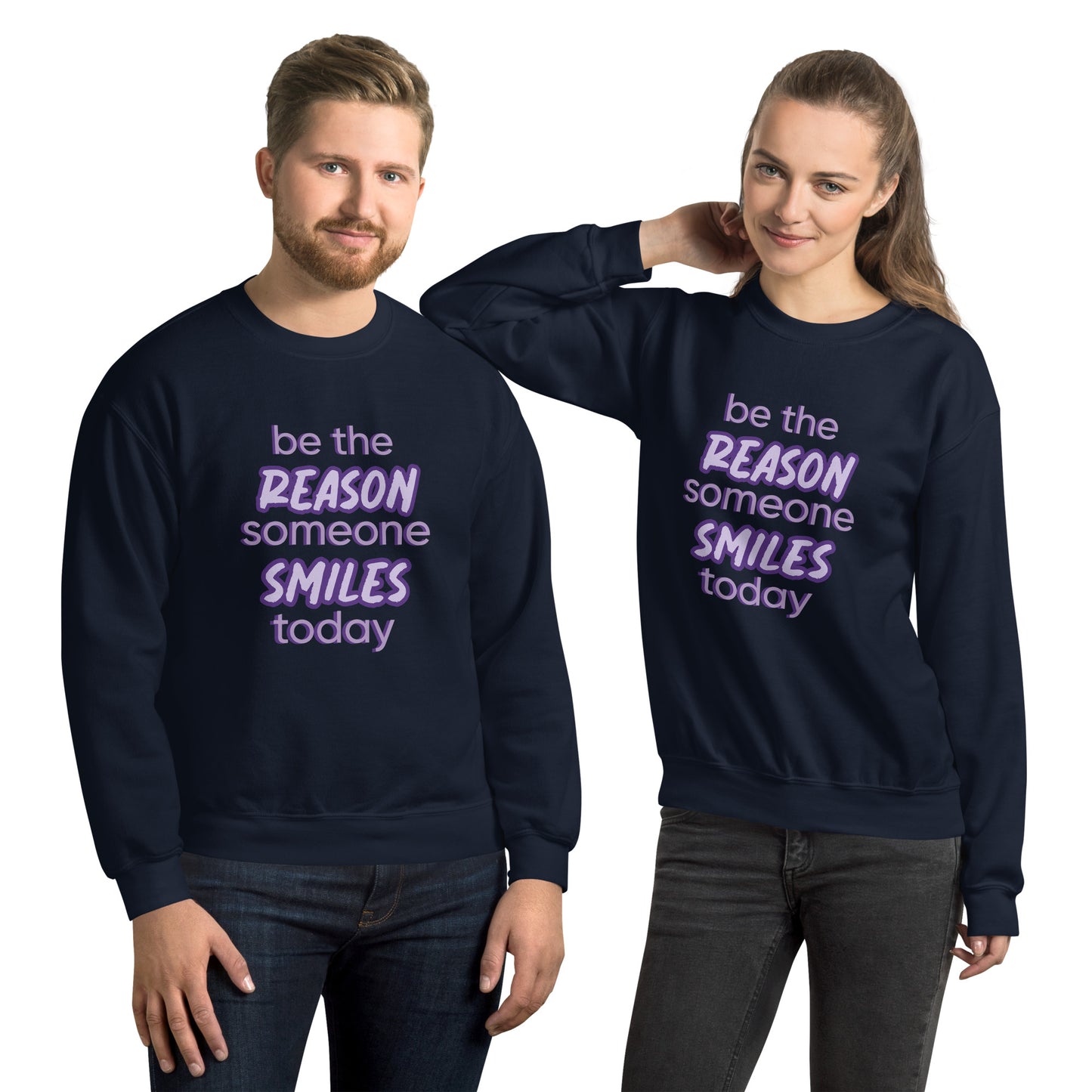 Men and women with navy sweater and the quote "be the reason someone smiles today" in purple on it. 
