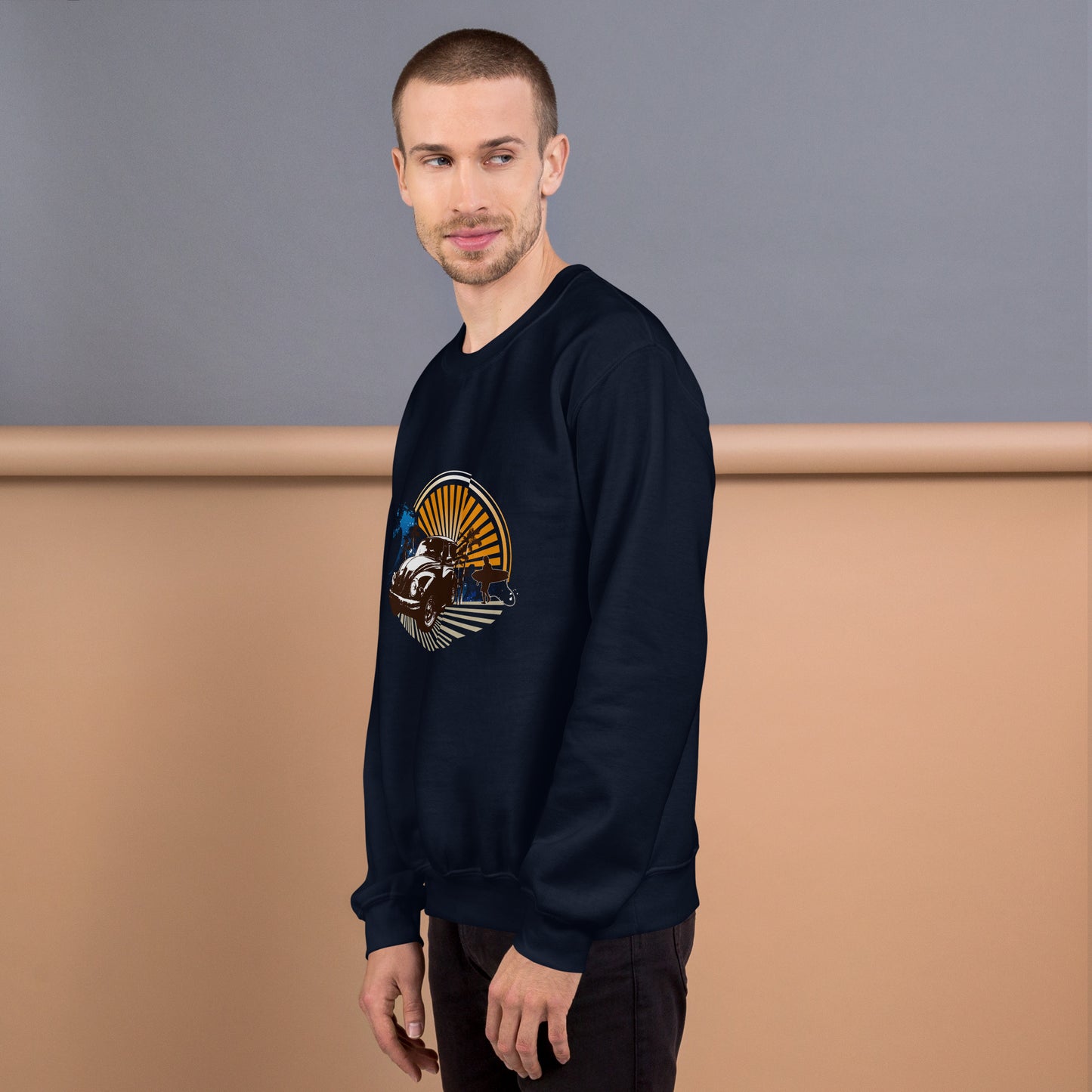 Men with navy blue sweatshirt with sunset and beetle car
