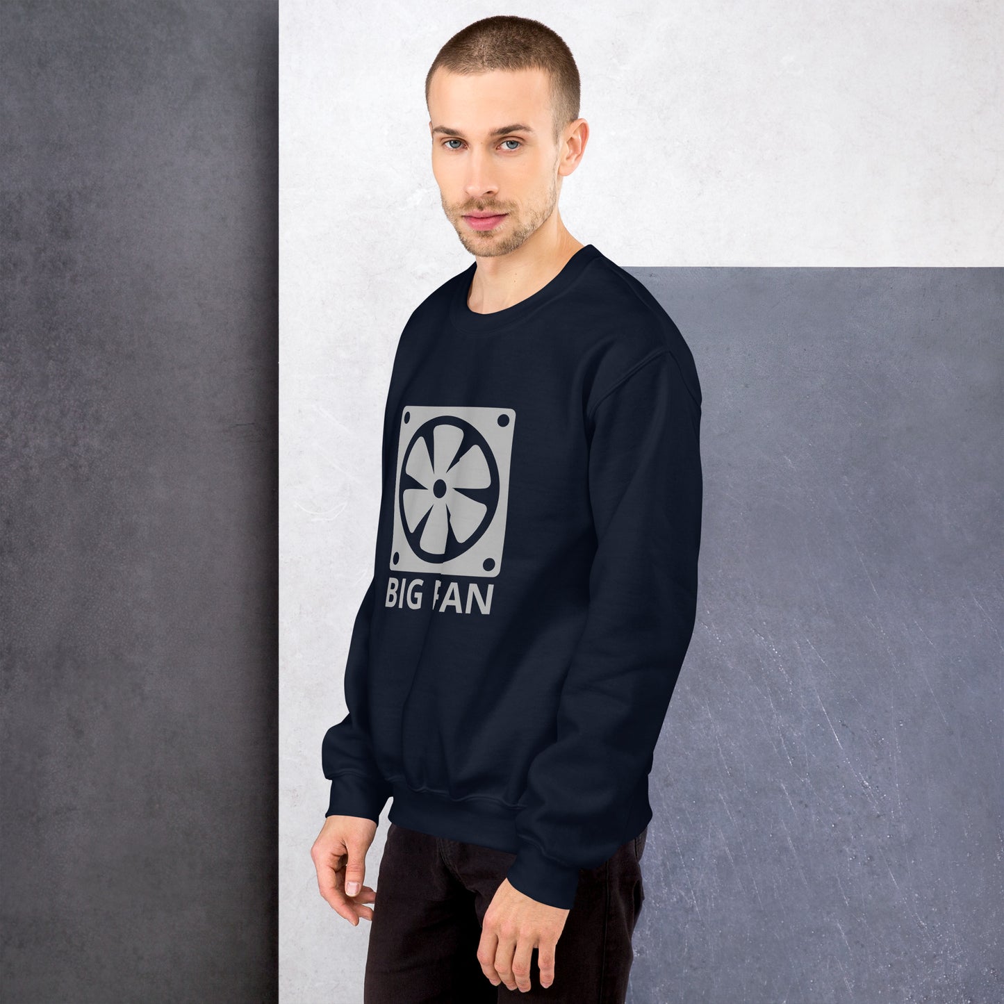 Men with navy blue sweatshirt with image of a big computer fan and the text "BIG FAN"