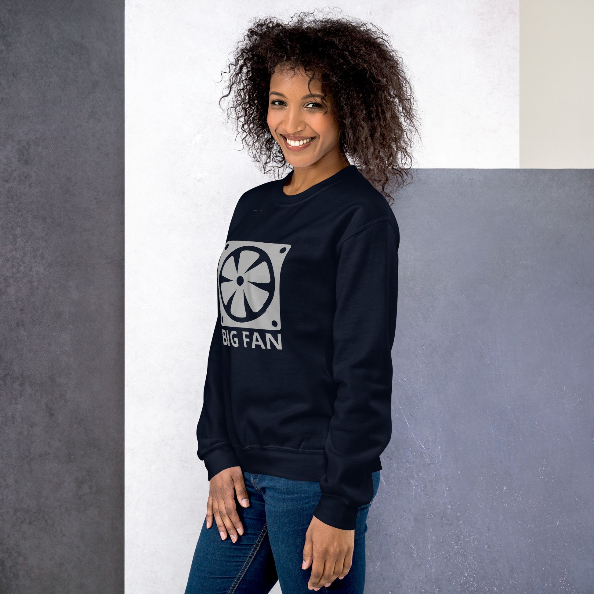 Women with navy blue sweatshirt with image of a big computer fan and the text "BIG FAN"