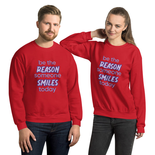 Men and women with red sweater and the quote "be the reason someone smiles today" in purple on it. 