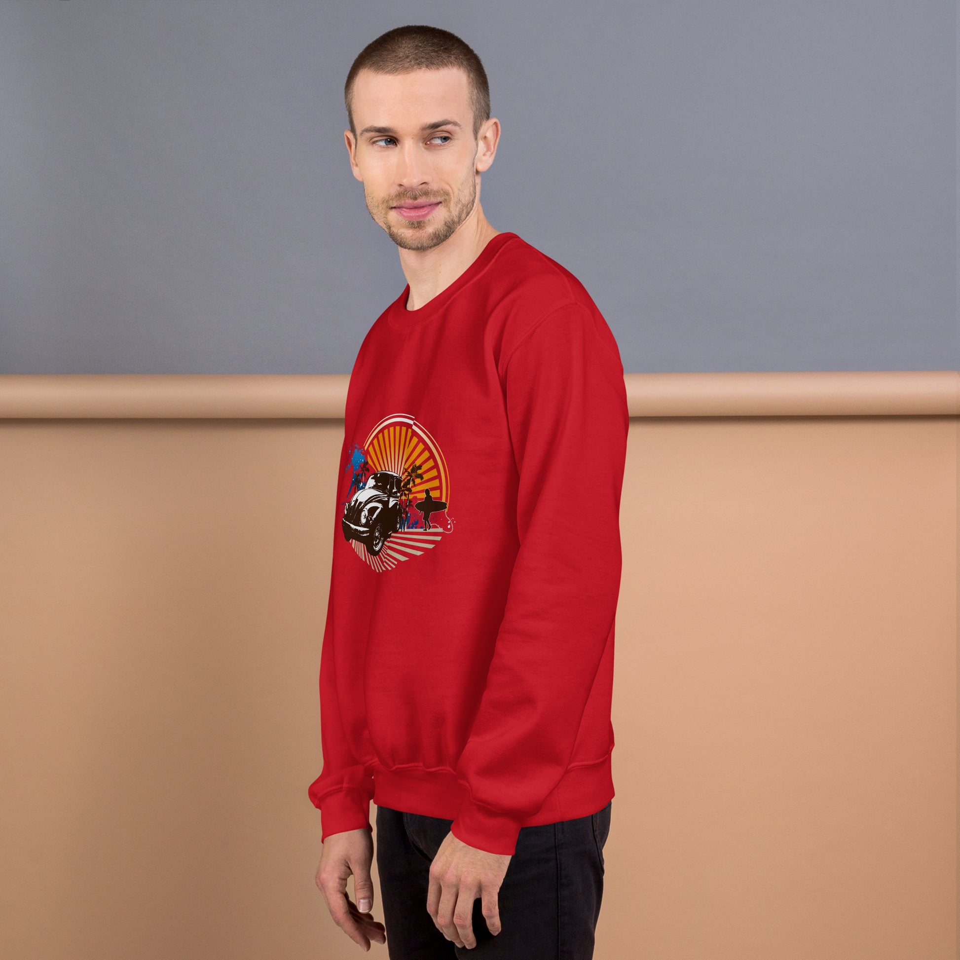 Men with red sweatshirt with sunset and beetle car
