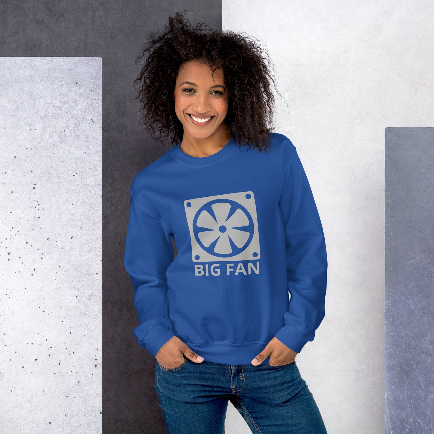 Women with royal blue sweatshirt with image of a big computer fan and the text "BIG FAN"