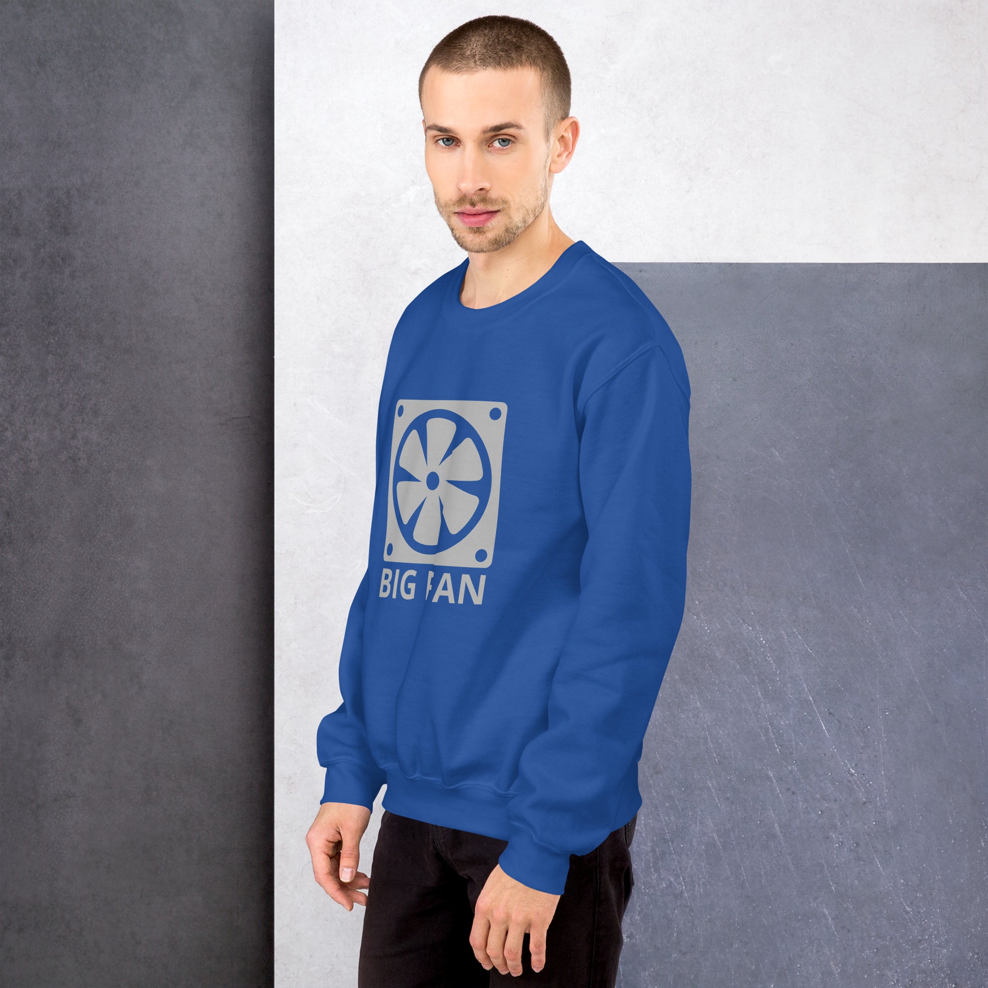 Men with royal blue sweatshirt with image of a big computer fan and the text "BIG FAN"
