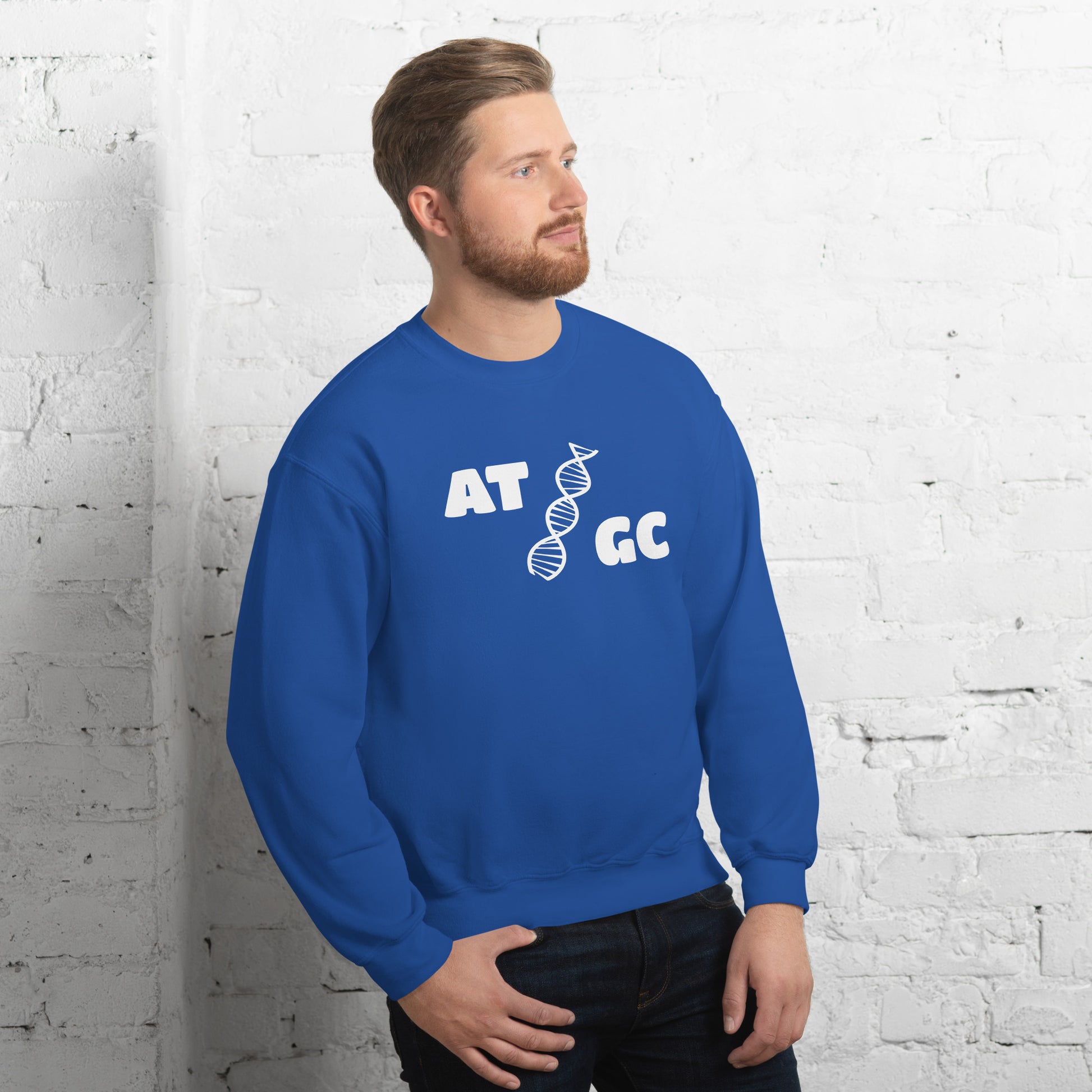 Men with royal blue sweatshirt with image of a DNA string and the text "ATGC"